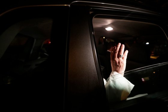 Pope Francis waves as he leaves Guanabara Palace where he attended a welcoming ceremony in Rio de Janeiro