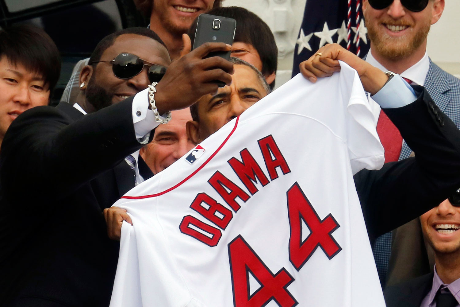 U.S. President Barack Obama poses with star player David Ortiz for a "selfie" as he welcomes the 2013 World Series Champion Boston Red Sox to the South Lawn of the White House in Washington, April 1, 2014. (Larry Downing—Reuters)