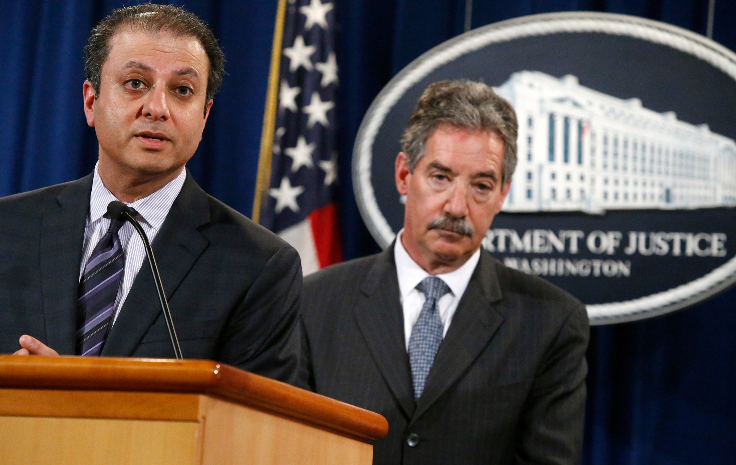 U.S. Attorney for the Southern District of New York Bharara speaks while flanked by U.S. Deputy Attorney General Cole as they announce a settlement with Anadarko Petroleum Corp in Washington