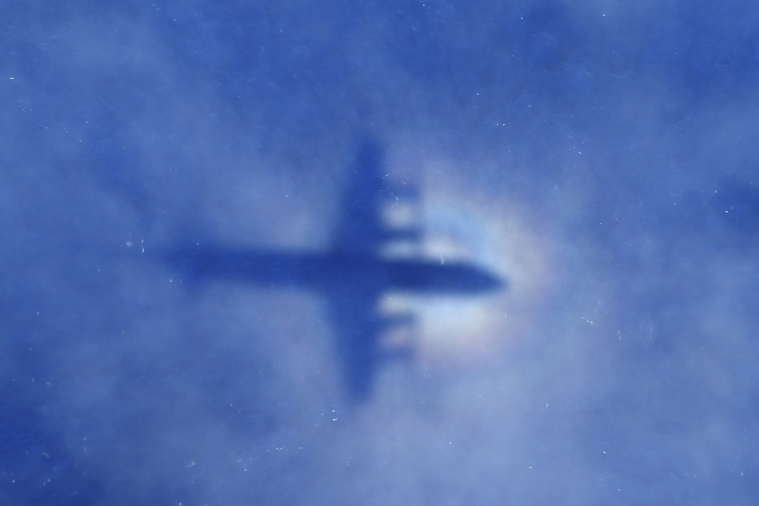 Mar. 31, 2014.
                              This shadow of a Royal New Zealand Air Force P3 Orion aircraft is seen on low cloud cover while it searches for missing Malaysia Airlines flight MH370, over the Indian Ocean.