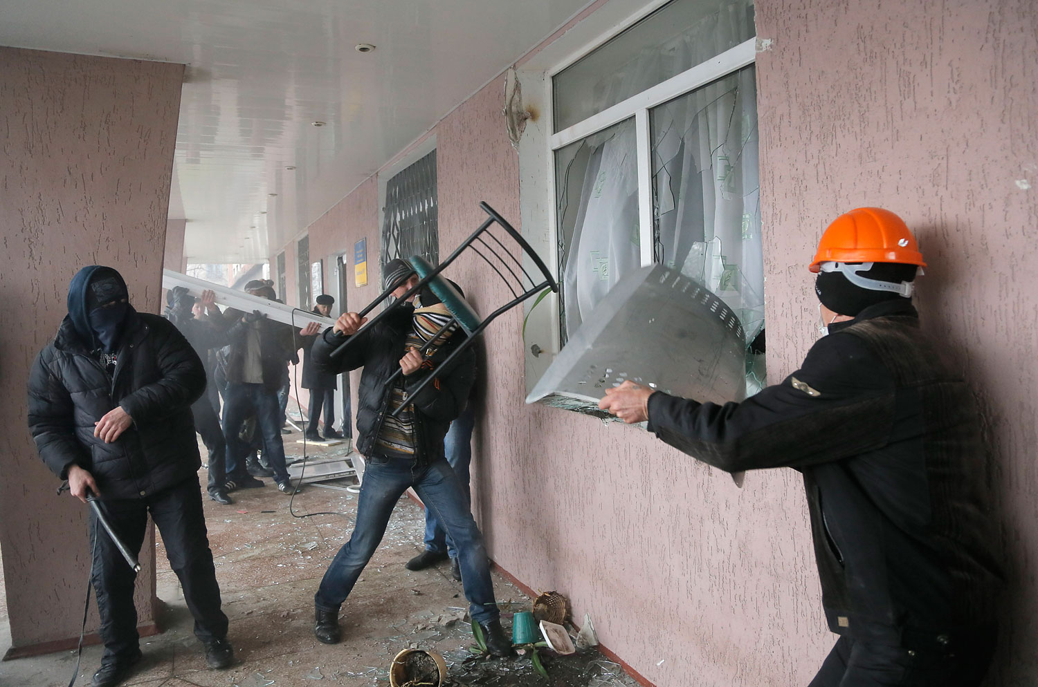 Pro-Russian men storm a police station in the eastern Ukrainian town of Horlivka on April 14, 2014.