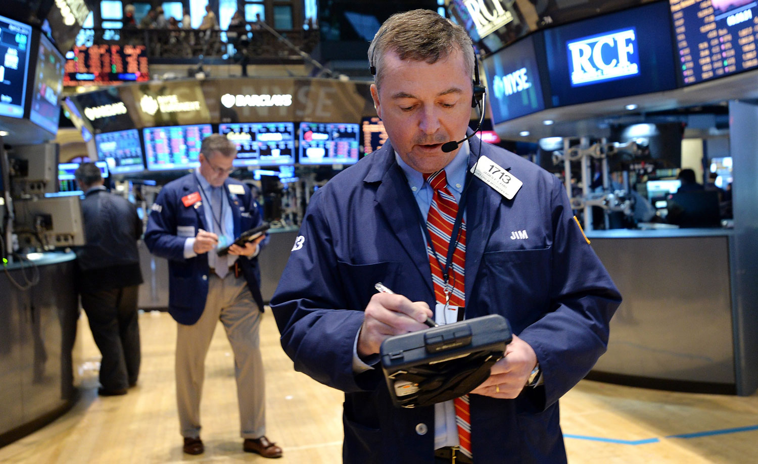 A trader works on the floor of the New York Stock Exchange at the end of the trading day in New York,  April 25, 2014. 