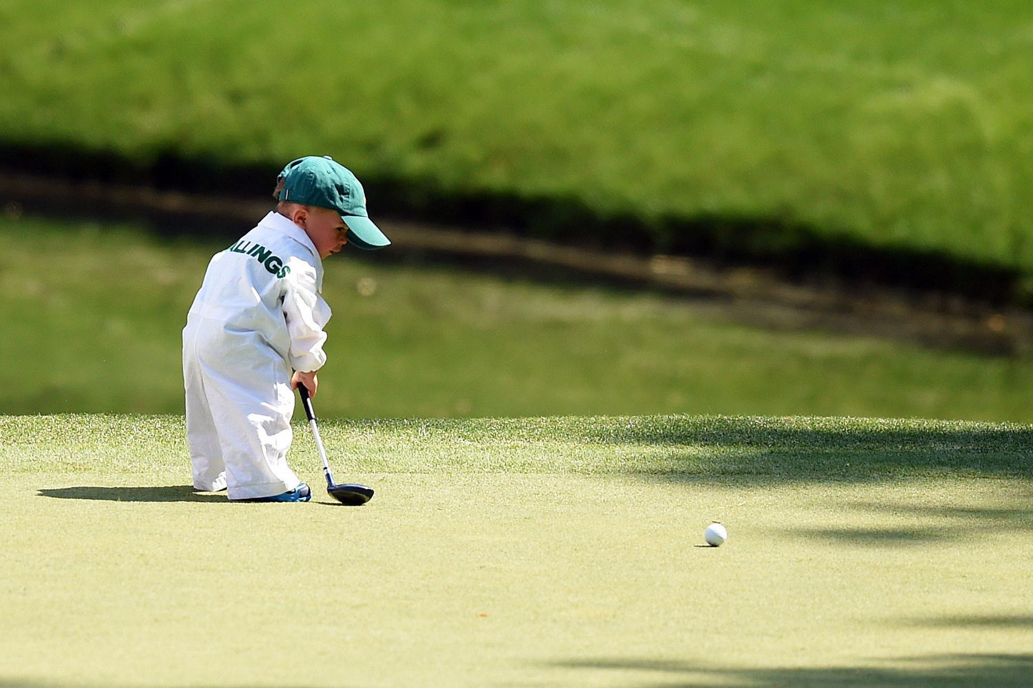 Finn, son of Scott Stallings of the U.S., plays during the Par 3 Contest prior the start of the 78th Masters Golf Tournament at Augusta National Golf Club on April 9, 2014 in Augusta, Georgia.