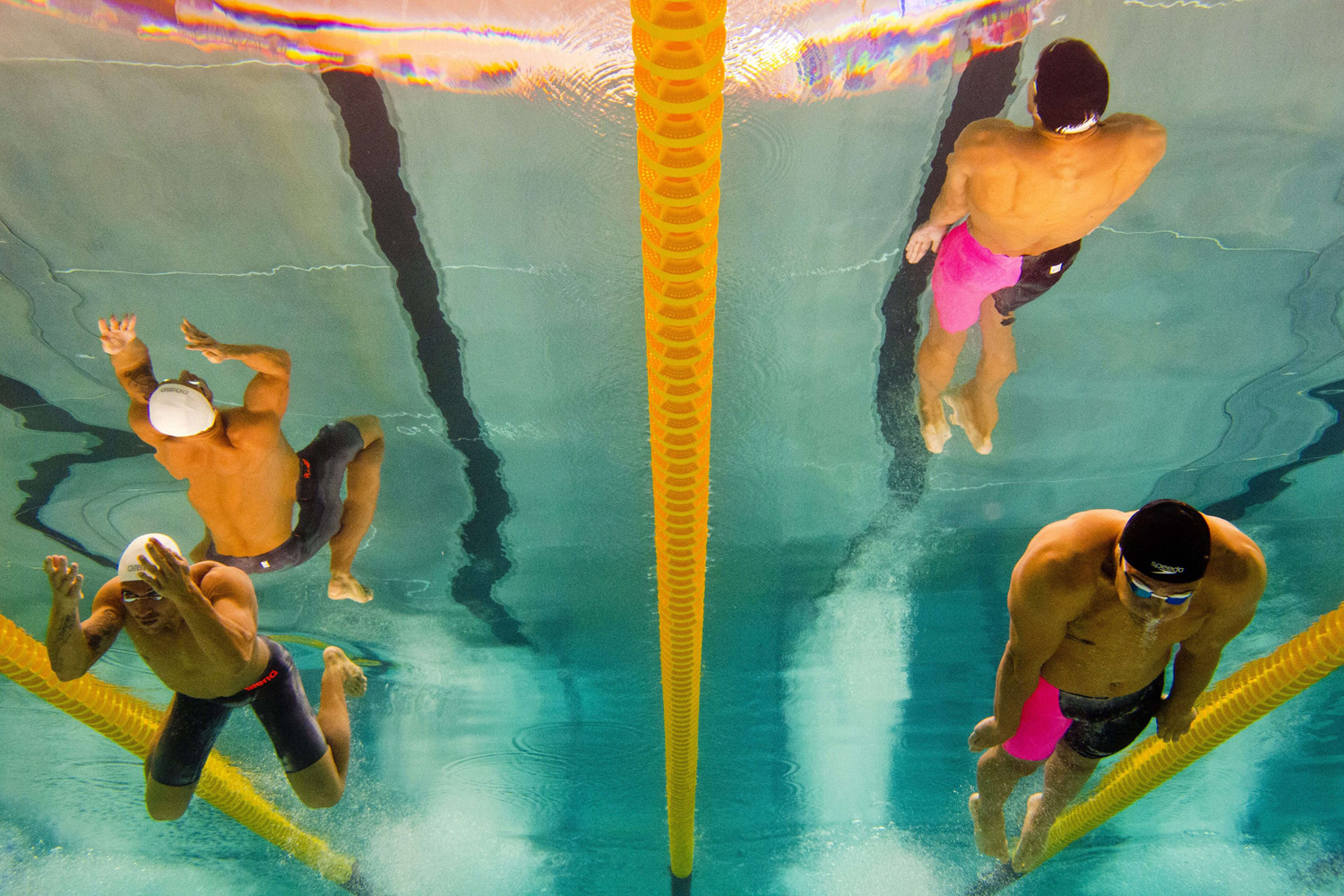 This picture taken with an underwater camera shows French swimmer Florent Manaudou (R) and silver medalist Giacomo Perez Dortona competing during the 50m breaststroke final on April 13, 2014.