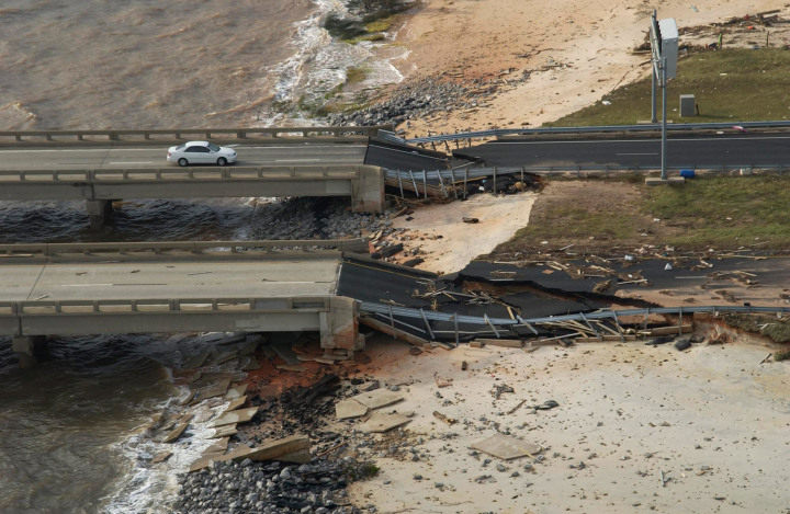 #6 Hurricane Ivan - A car sits at the edge of the I-10 bridge between Pensacola and Santa Rosa, Fla., Sept. 16, 2004, after the bridge was damaged by Hurricane Ivan. The more powerful storm in the great hurricane year of 2004, Ivan killed over 100 people and caused nearly $20 billion in damages.