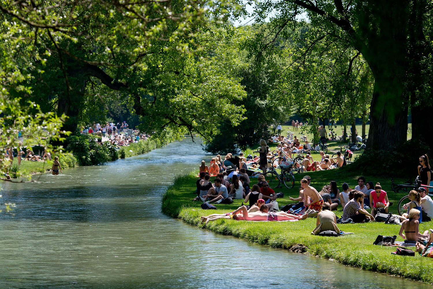 People enjoy the warm weather in the English Gardens in Munich, on May 21, 2014.