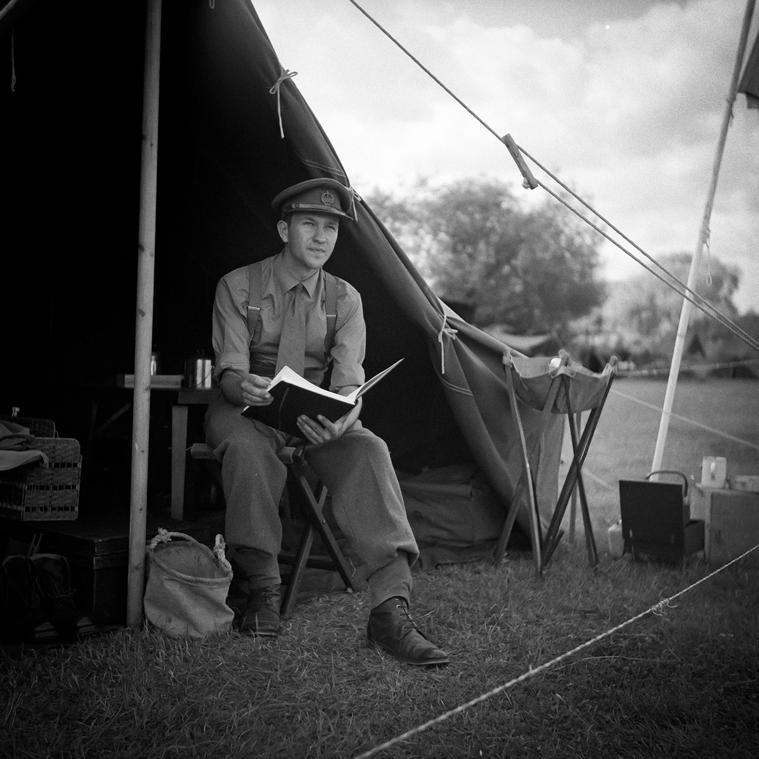 It's difficult for reenactors to find and use actual 1940s kit — original uniforms are expensive, and soldiers were shorter and thinner during World War II than your average modern day reenactor. Most of the uniforms are careful reproductions. Bradley Cooper, however, has an incredible collection of original gear (everything in his tent is from mid to late 1944). Here, he's reenacting as an Essex regiment officer with the Essex Second Battalion at Damyns Hall Aerodrome.