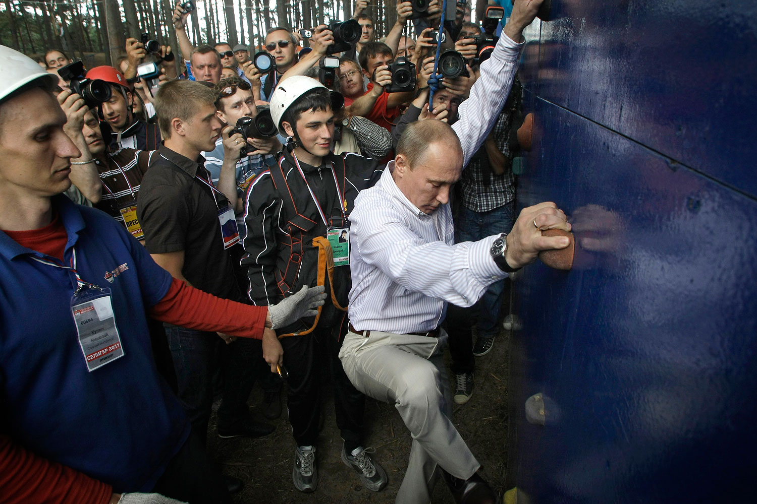 Putin scales a climbing wall during his visit to the summer camp, located 248 miles north of Moscow, Aug. 1, 2011.
