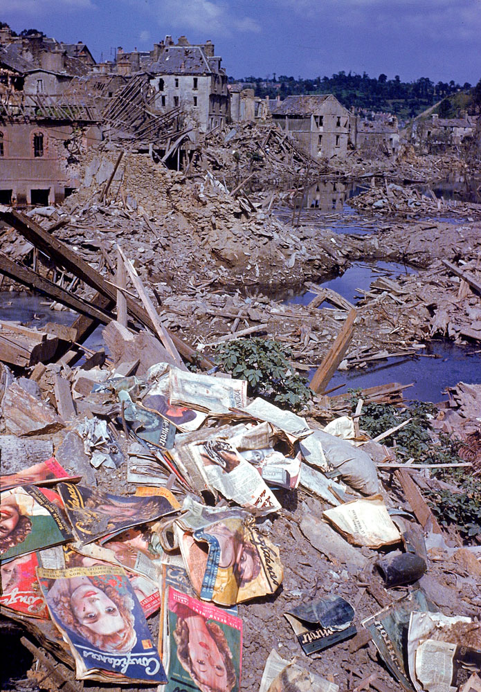 Magazines scattered among the rubble of the heavily bombed town of Saint-Lô, Normandy, France, summer 1944.