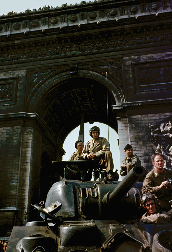 Tanks under the Arc de Triomphe in Paris during liberation celebrations, August 1944.