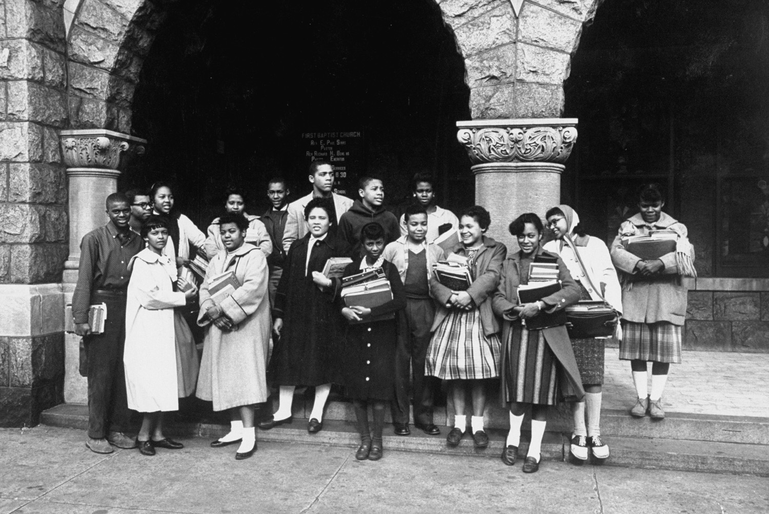 Seventeen of the African American students who were ordered admitted to white schools in Norfolk, Va., pose for a photo at a church where they had been getting private schooling, 1959.