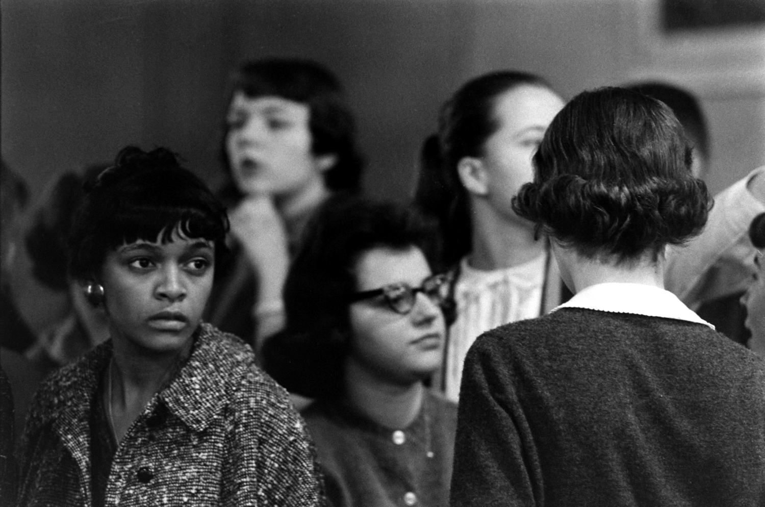 Alone in line, Betty Jean Reed tensely waits for lunch at Granby High cafeteria as other students ignore her.