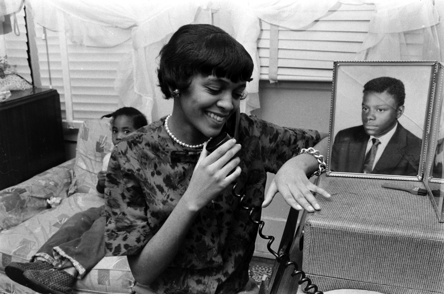 Betty Jean Reed on the phone with a friend during her first week as the only African American student at Granby High School, Norfolk, Va., 1959.