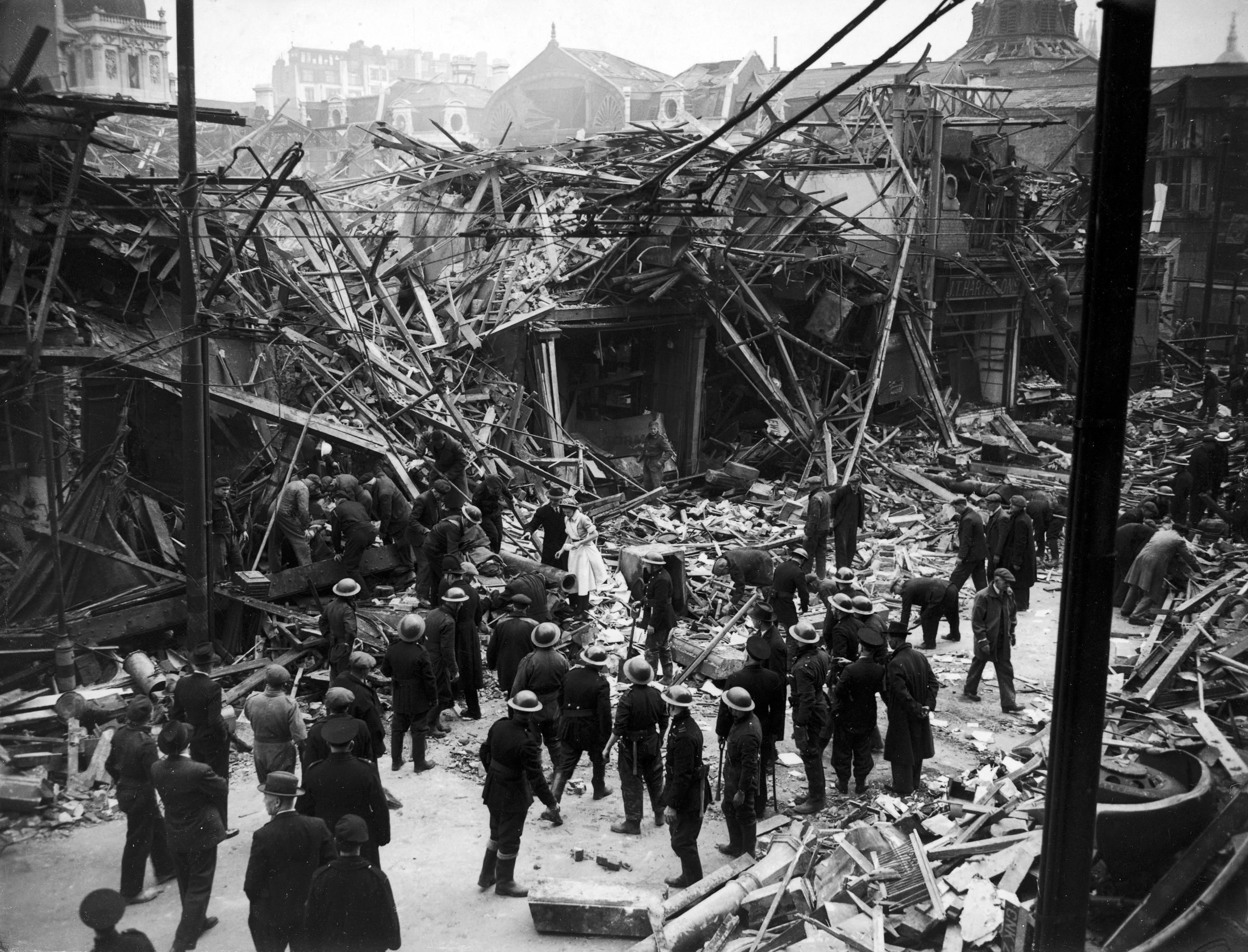 Rescue workers help pull victims from ruins of a building hit by a German V-1 "flying bomb" rocket, July 1944.
