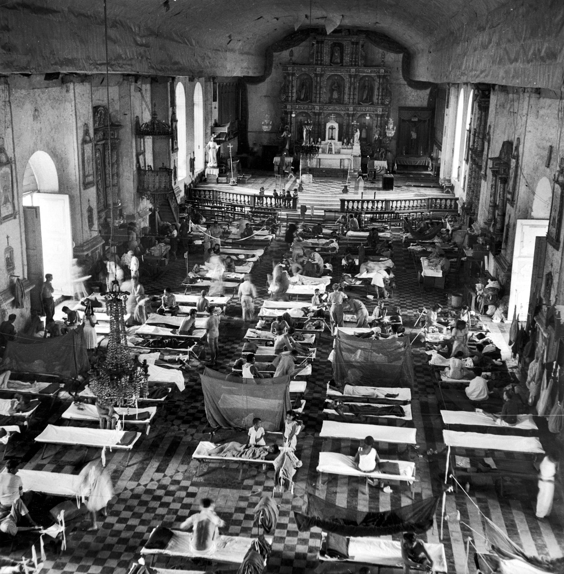 Cathedral turned into a makeshift hospital during the Allied campaign to retake the Philippines, December 1944.