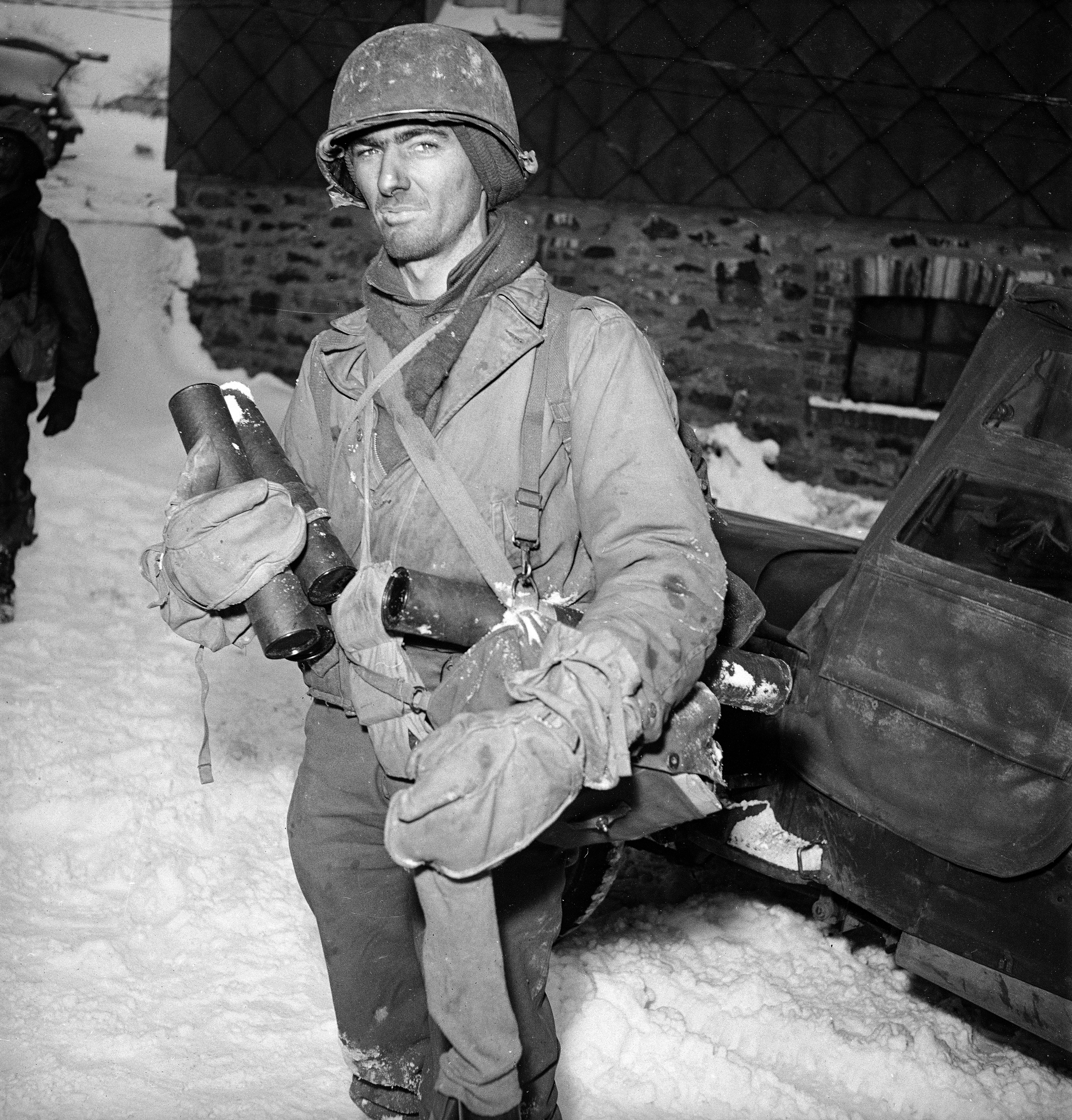 A tired American soldier just back from the front lines during the Battle of the Bulge, December 1944.