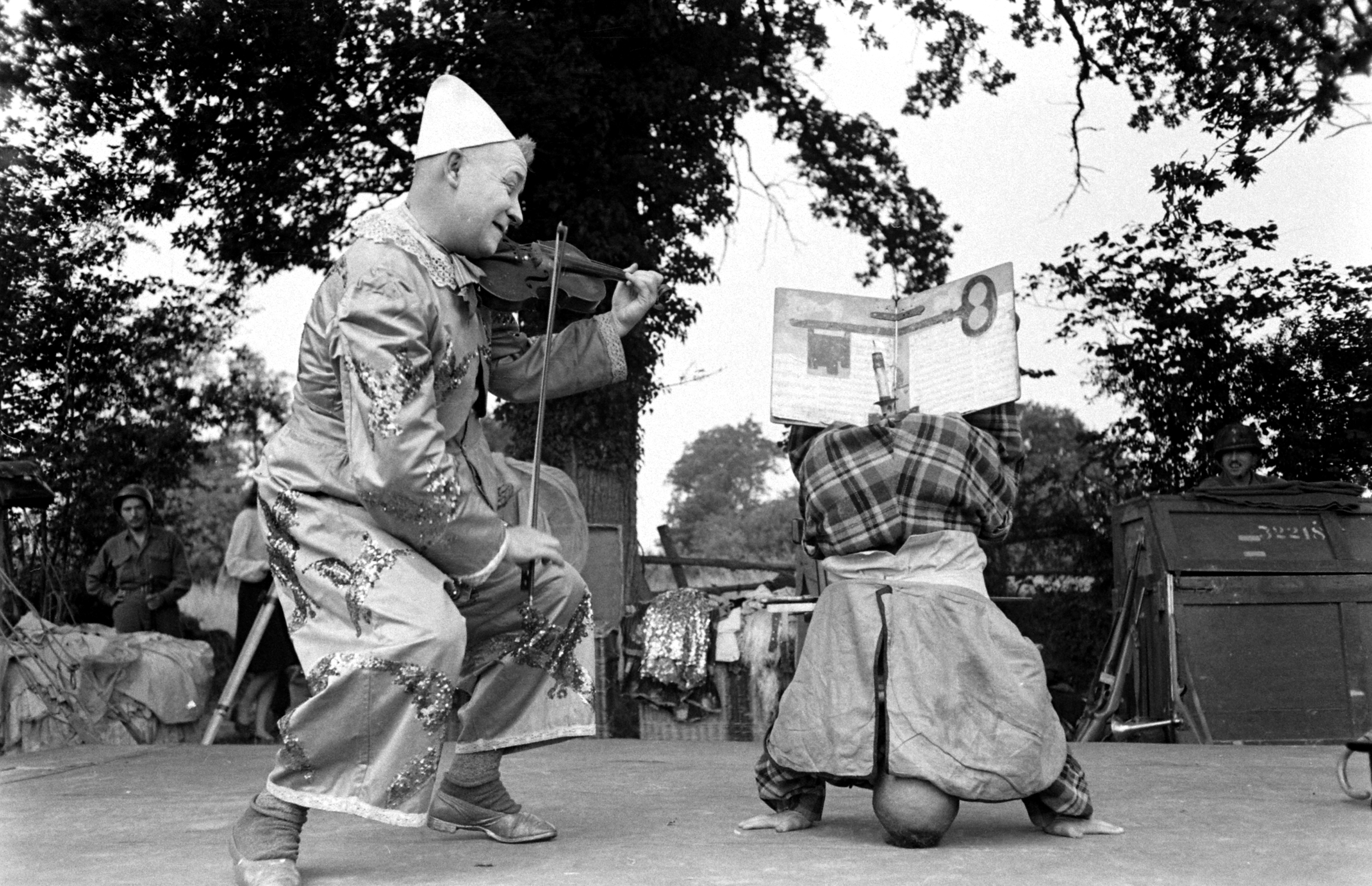 Clowns in show for U.S. troops after D-Day, Normandy, 1944.