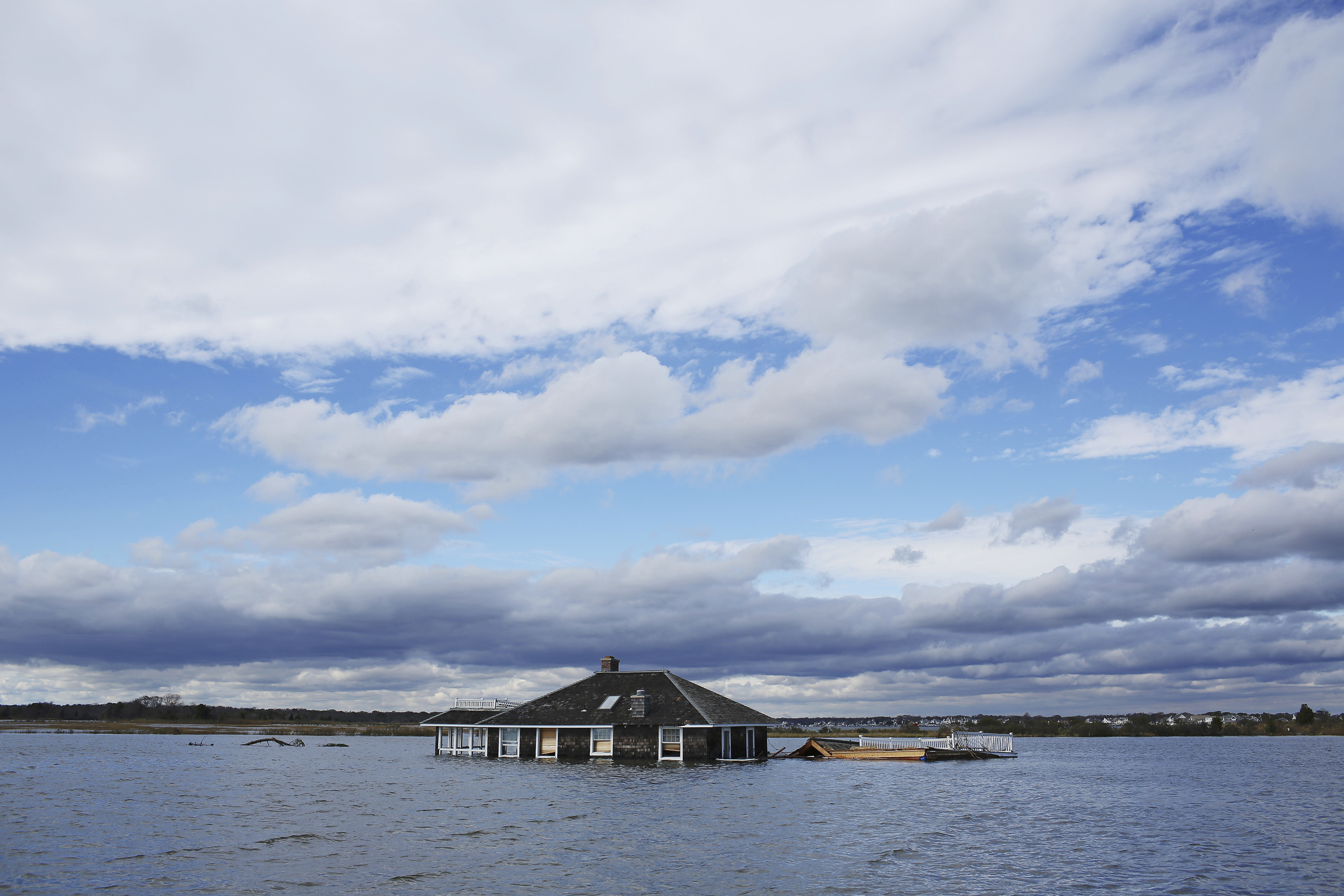 Deep trouble.A shore house near Mantoloking, N.J., sits in a lagoon after Superstorm Sandy in October 2012. (Andrew Quilty— Oculi/Redux)