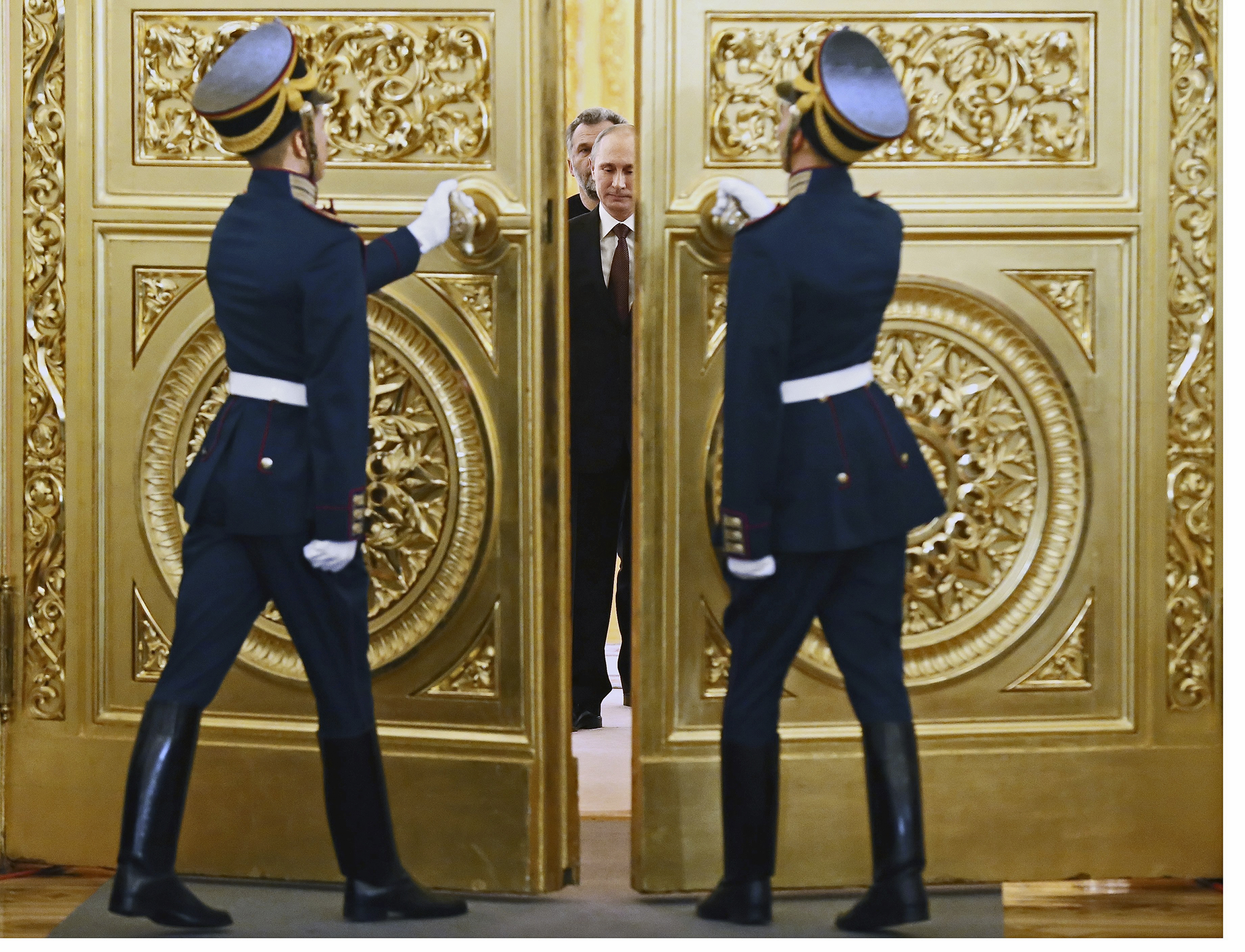 Redrawing the map Putin enters a gilded Kremlin hall to sign a treaty formalizing the Russian annexation of Crimea (Sergei Ilnitsky—AP)