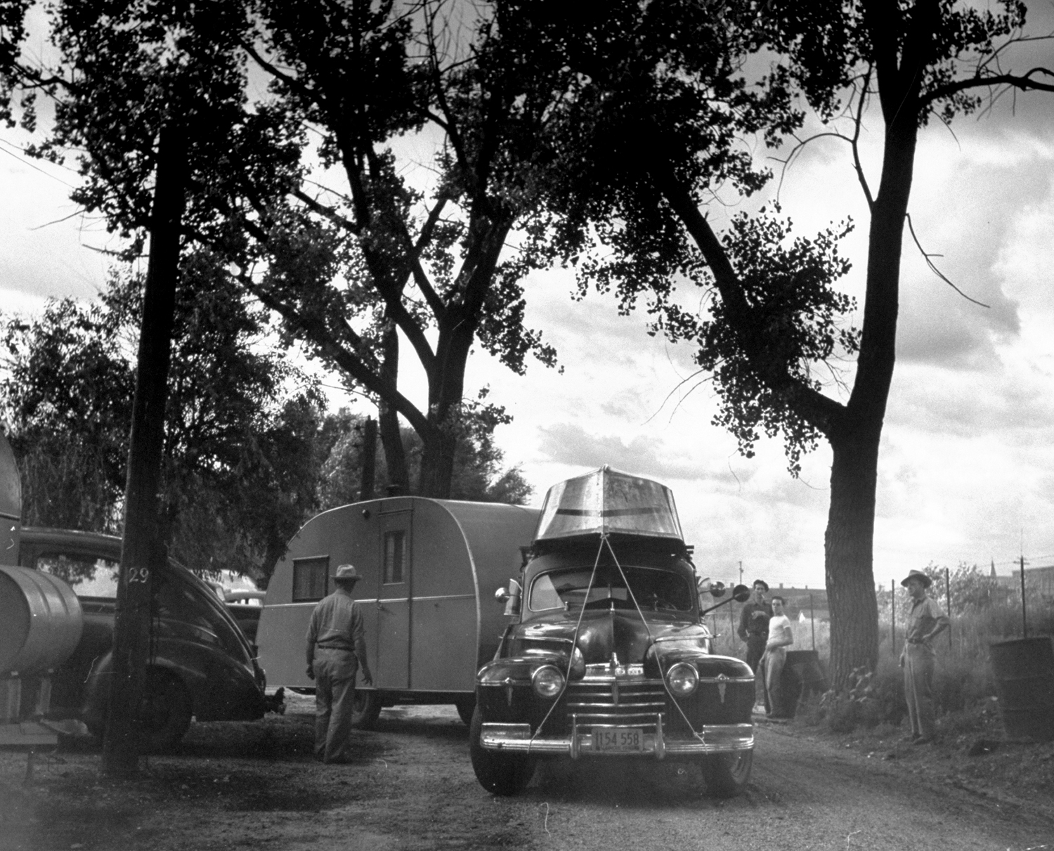 Cars pulling out of trailer camp onto Route 30, Nebraska, 1948.