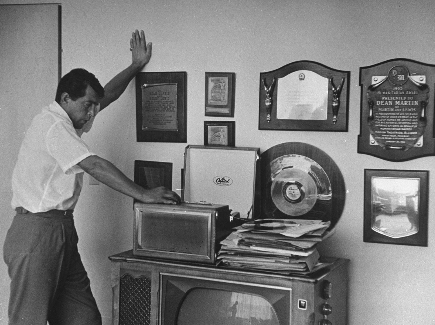 Dean Martin listening to music at home, 1958.