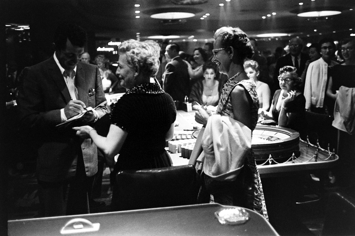 Dean Martin signing autographs, Las Vegas, 1958.