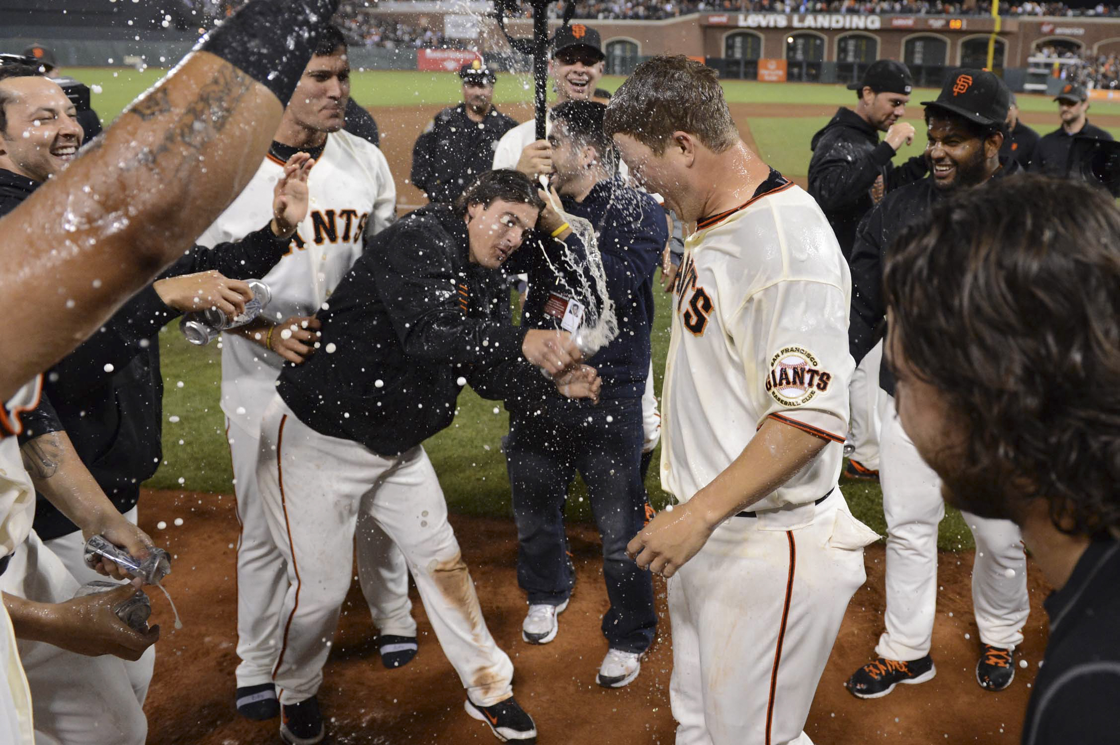 Matt Cain of the San Francisco Giants is sprayed with a beer by teammate Ryan Theriot after pitching a perfect game against the Houston Astros at AT&amp;T Park on Wednesday, June 13, 2012 in San Francisco, Ca.