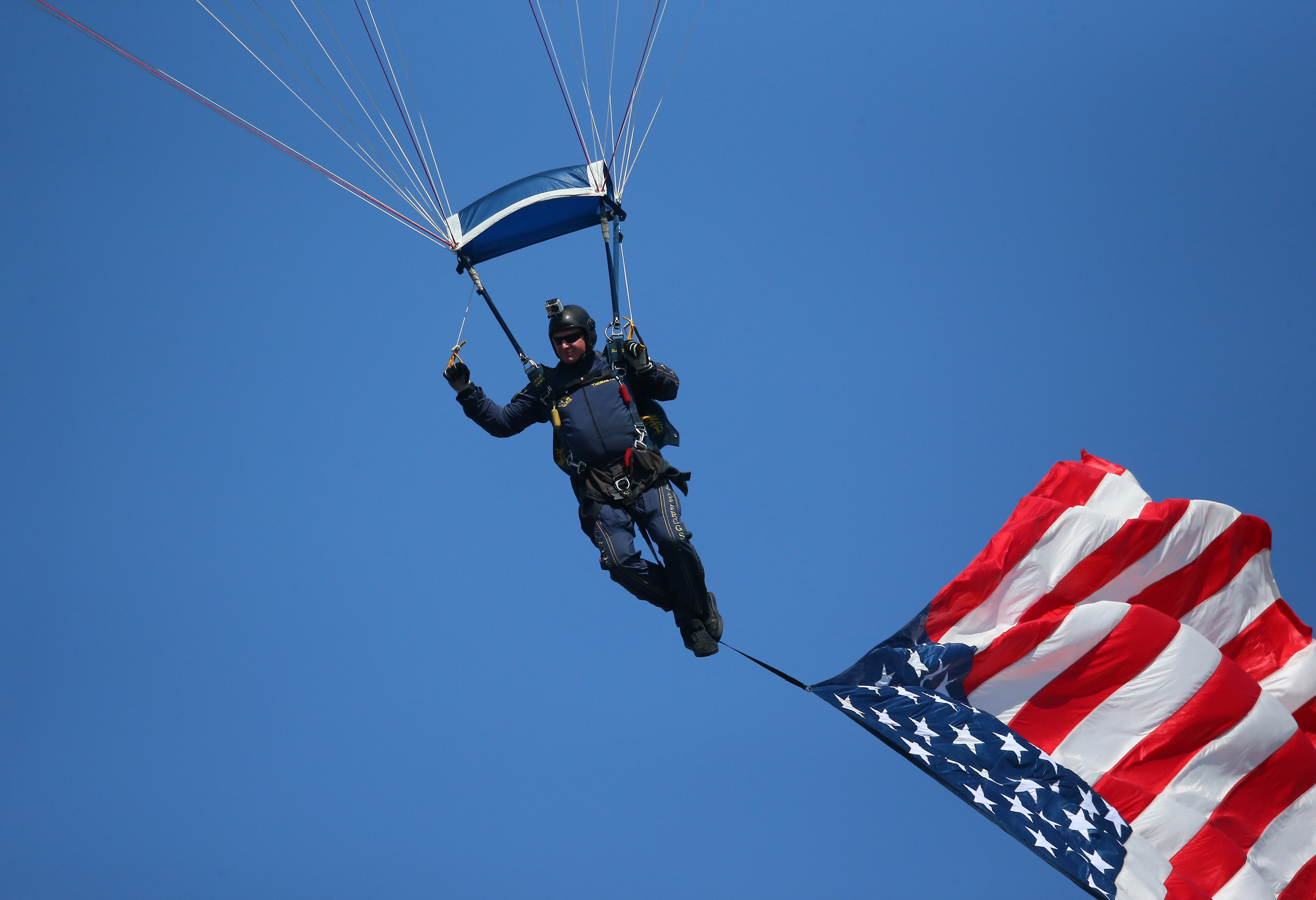 A NAVY Seal parachutes down before the start of the Buffalo Bills NFL game against the Kansas City Chiefs at Ralph Wilson Stadium on September 16, 2012 in Orchard Park, New York. (Tom Szczerbowski—Getty Images)