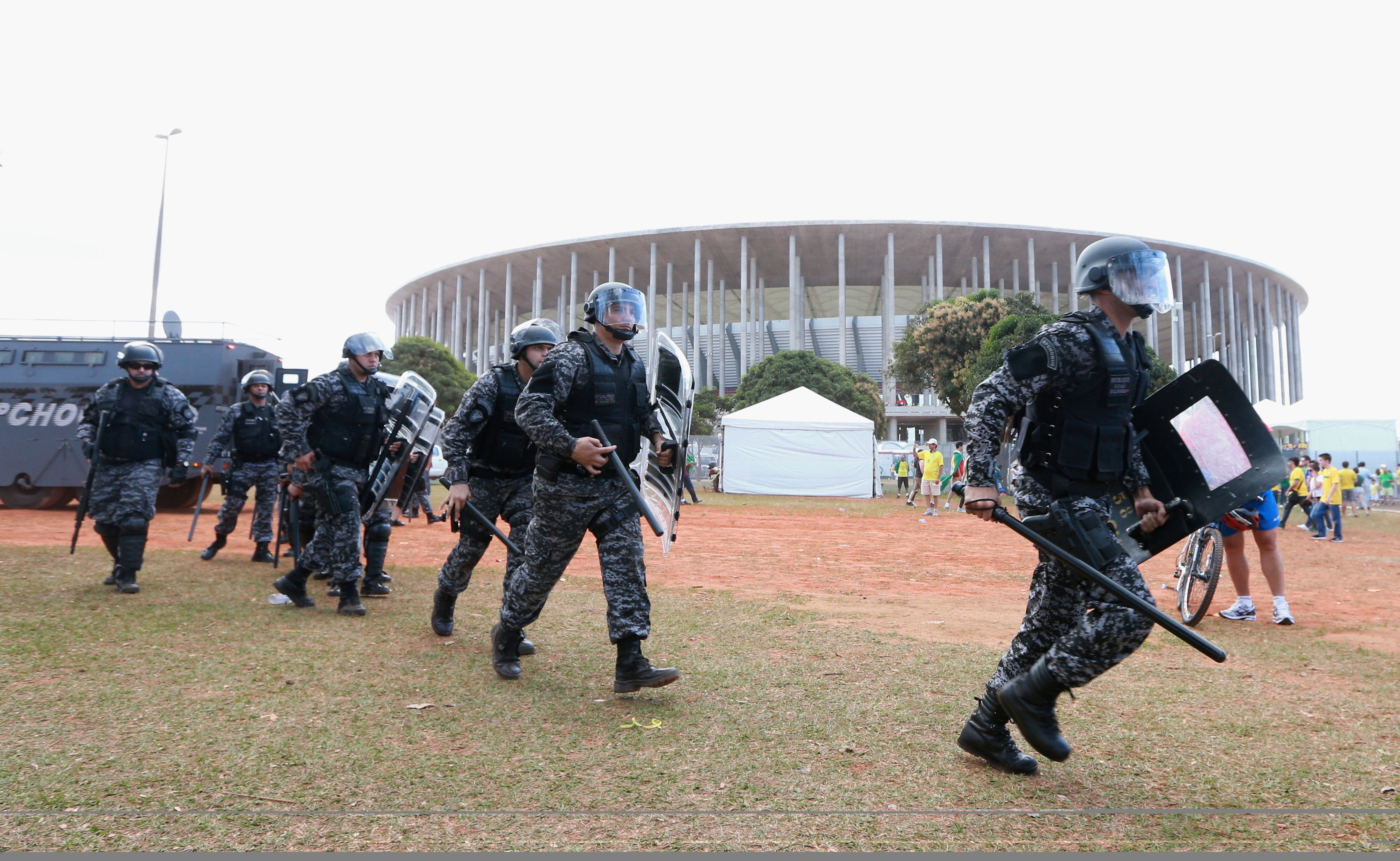 Security services patrol as protestors gather prior to the FIFA Confederations Cup Brazil 2013 Group A match between Brazil and Japan at National Stadium on June 15, 2013 (Scott Heavey—Getty Images)