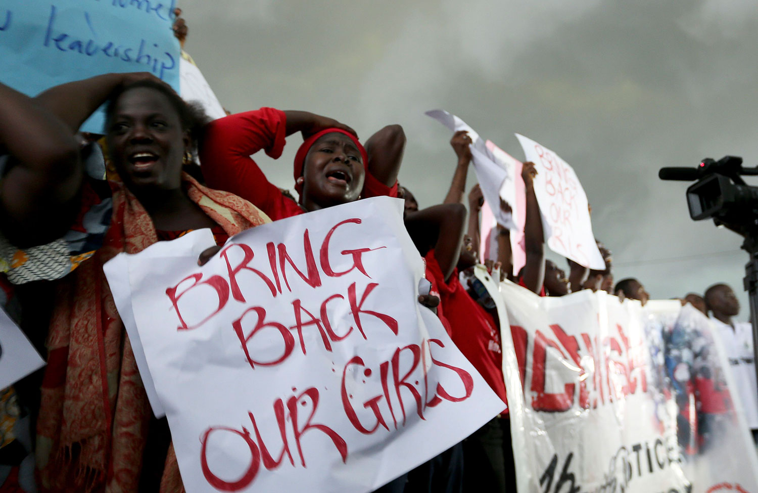 Nigerian women demonstrate outside the parliamentary building in Abuja, the country's capital, on April 30, 2014, demanding the government to search harder for more than 200 schoolgirls abducted by Islamist militants Boko Haram two weeks ago (Afolabi Sotunde—Reuters)