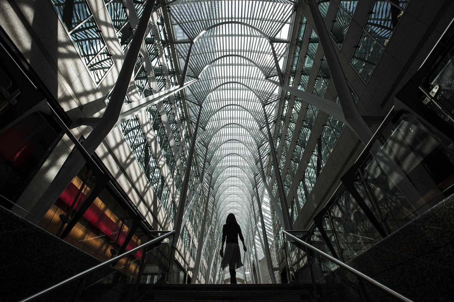 May 7, 2014. A woman walks through Brookfield Place off Bay Street, on the day of annual general meeting for Brookfield Asset Management shareholders in Toronto, Canada.