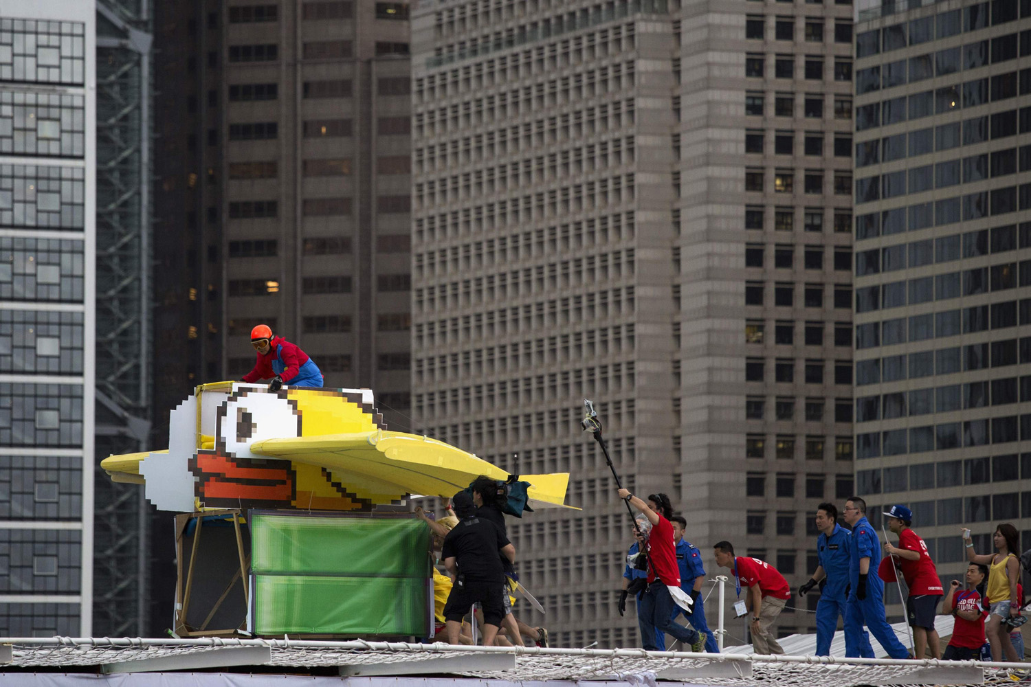 A participant operates the "Flappy Bird", a self-made flying machine, during the Red Bull Flugtag event at Hong Kong's financial Central district May 11, 2014.