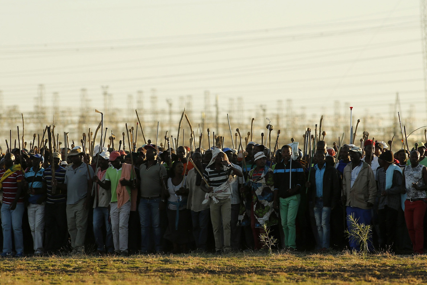 Miners on strike chant slogans as they march in Nkaneng township outside the Lonmin mine in Rustenburg