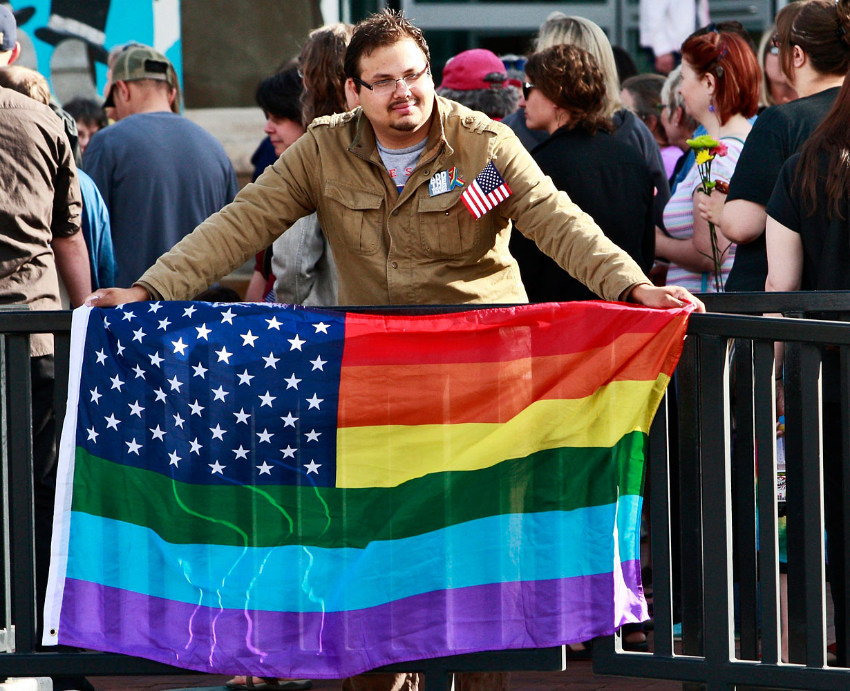 A gay marriage supporter holds his interpretation of the American flag at a rally for gay marriage at the Ada County Court House  in Boise, Idaho May 16, 2014. (Brian Losness—Reuters)