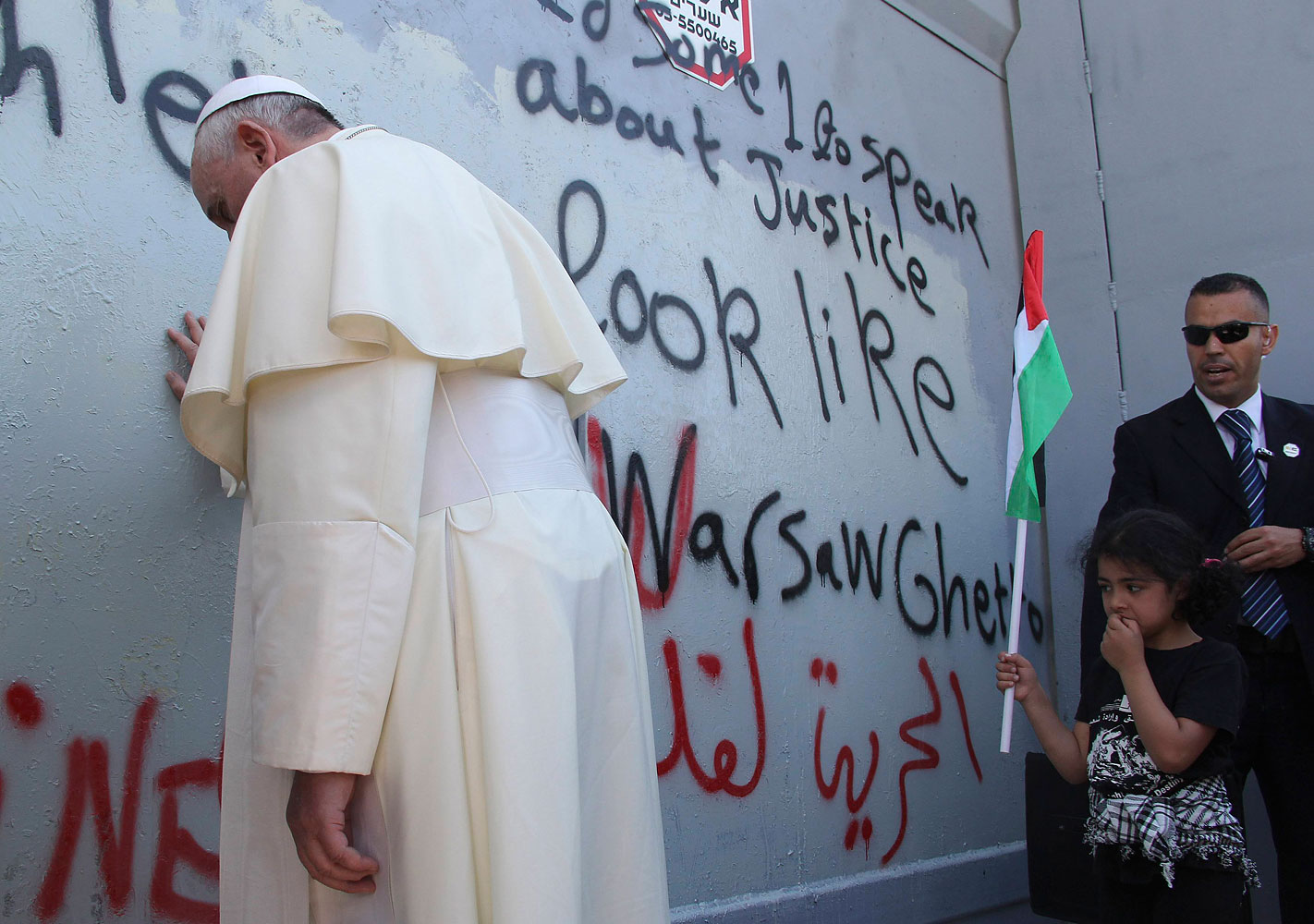 Pope Francis touches the wall that divides Israel from the West Bank in the West Bank city of Bethlehem