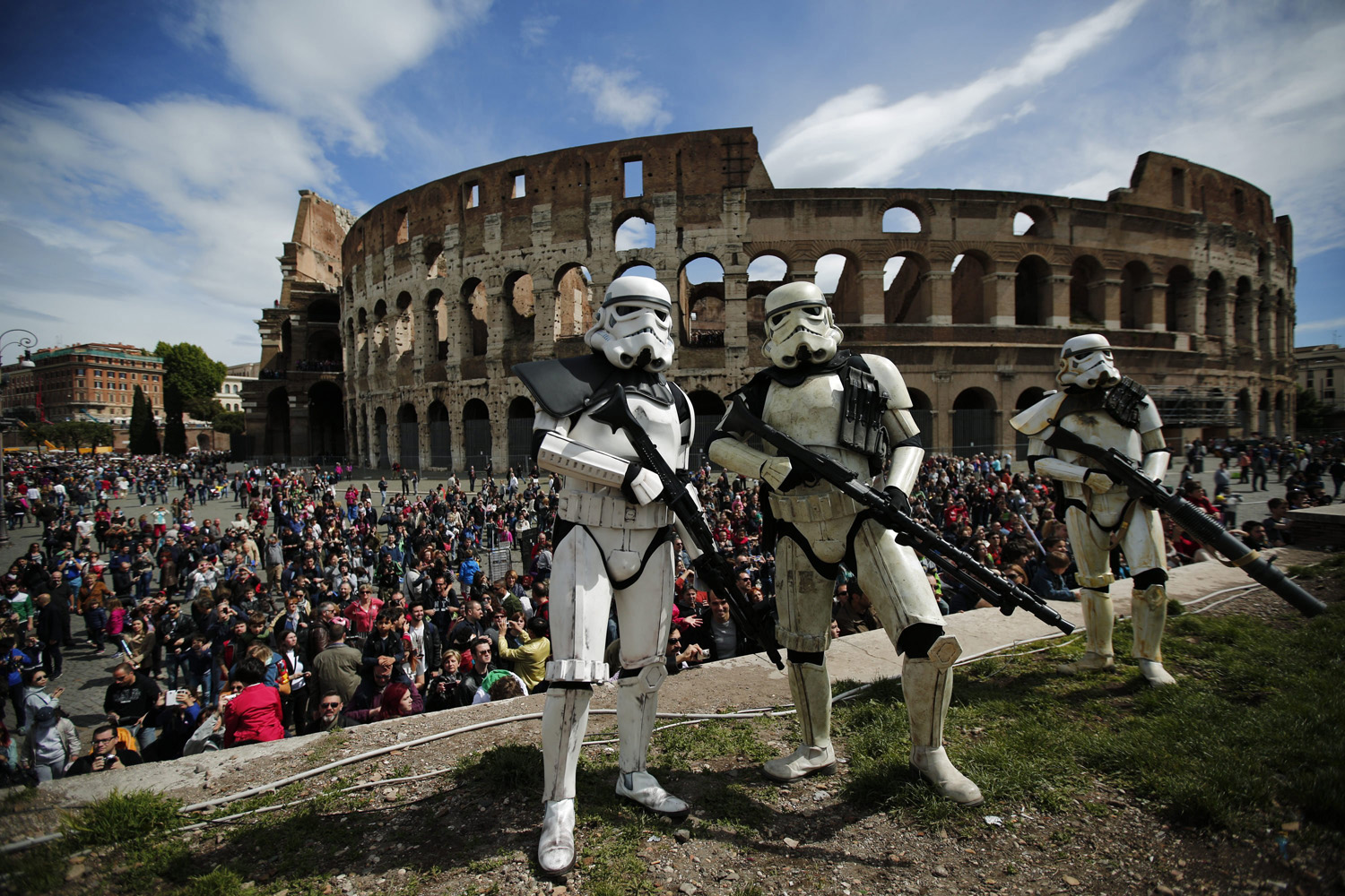 Members of the Star Wars fan club dressed as stormtroopers celebrate Star Wars Day in front of the Colosseum in central Rome on May 4, 2014.