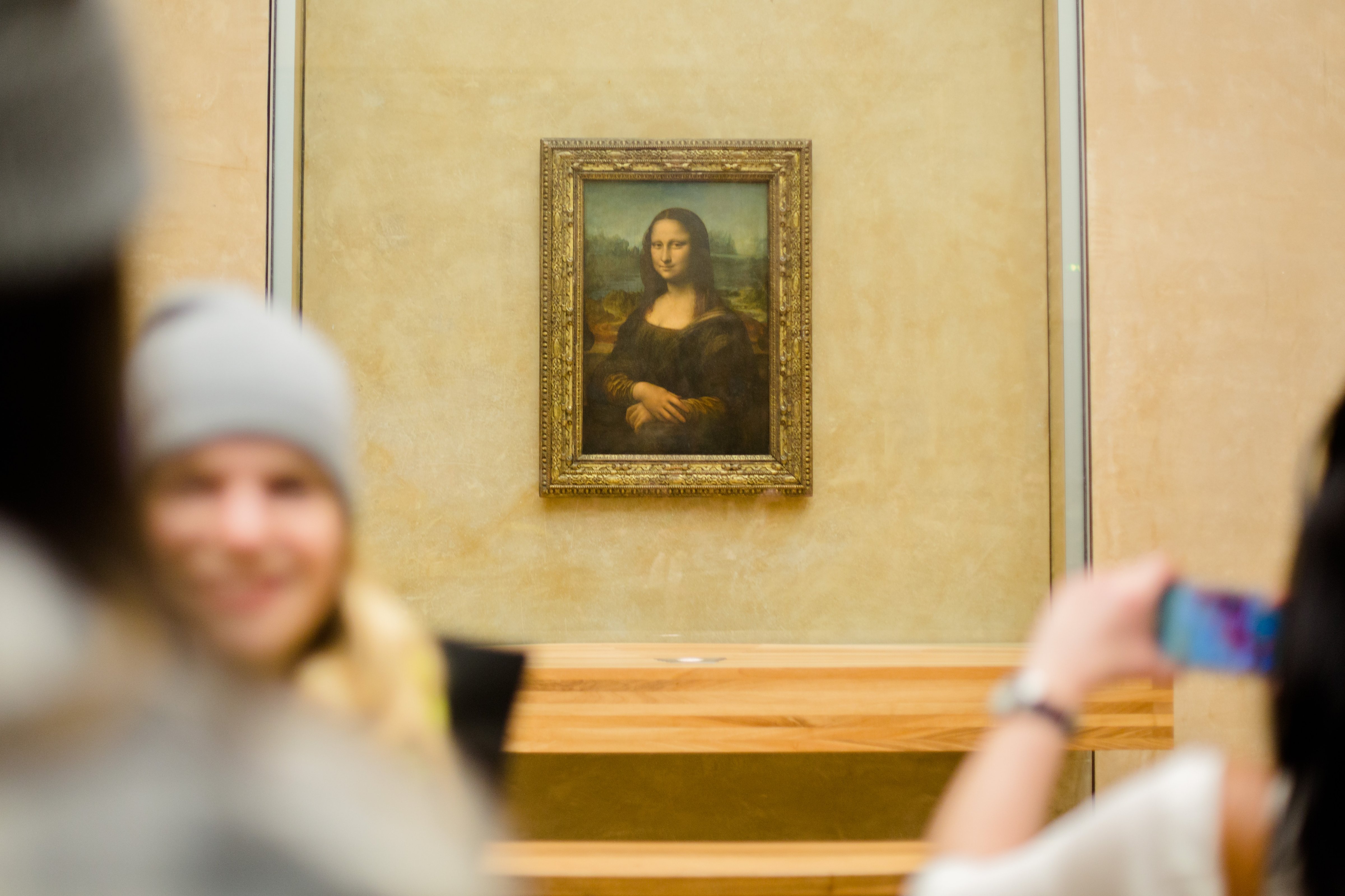 Visitors take pictures of Leonardo da Vinci 'Mona Lisa' inside the Louvre museum on Feb. 28, 2014 in Paris. (Christian Marquardt—Getty Images)