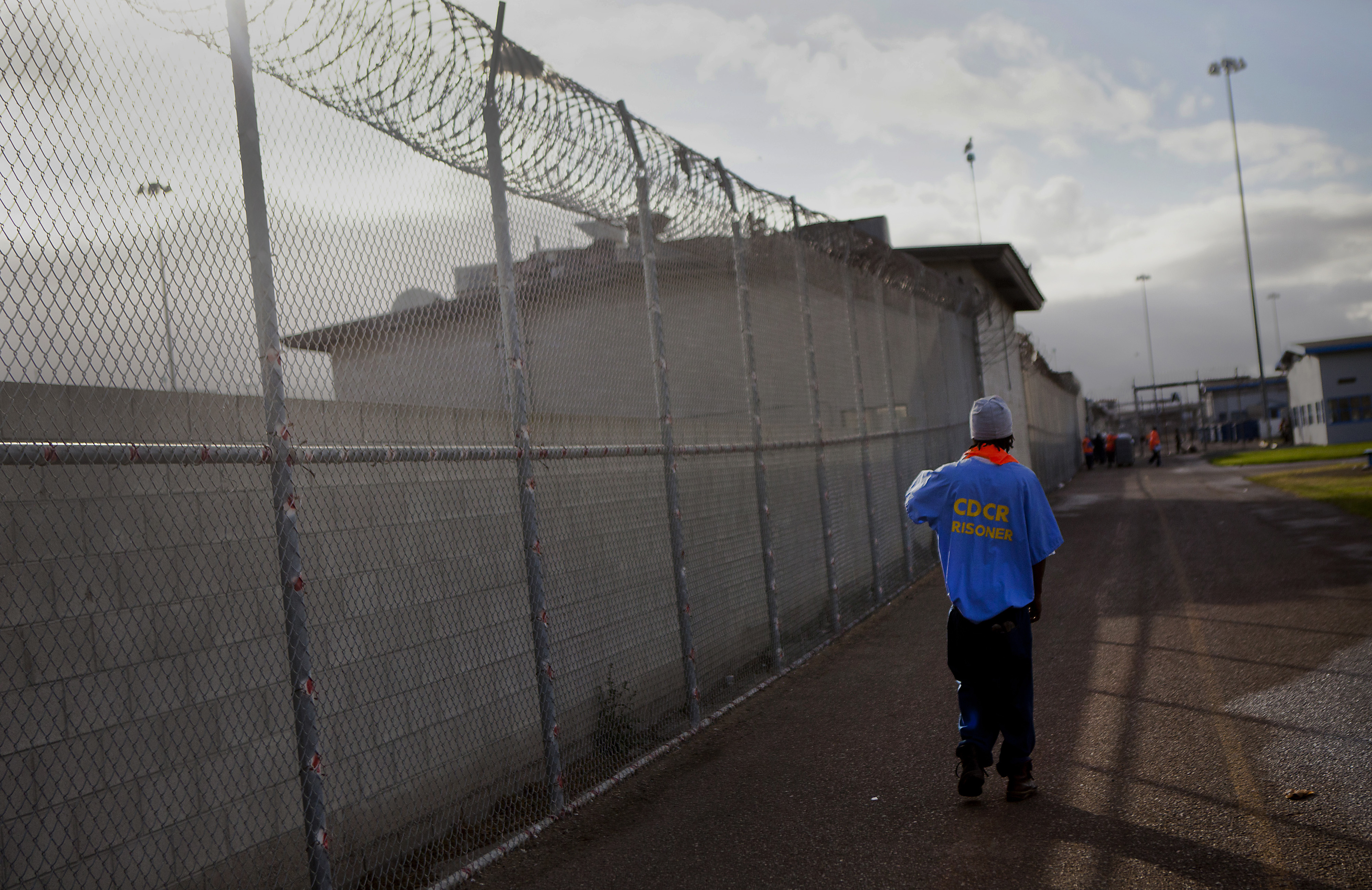 An inmate walks through the yard at the Richard J. Donovan Correctional Facility in San Diego on March 26, 2014. (Sam Hodgson—Bloomberg/Getty Images)