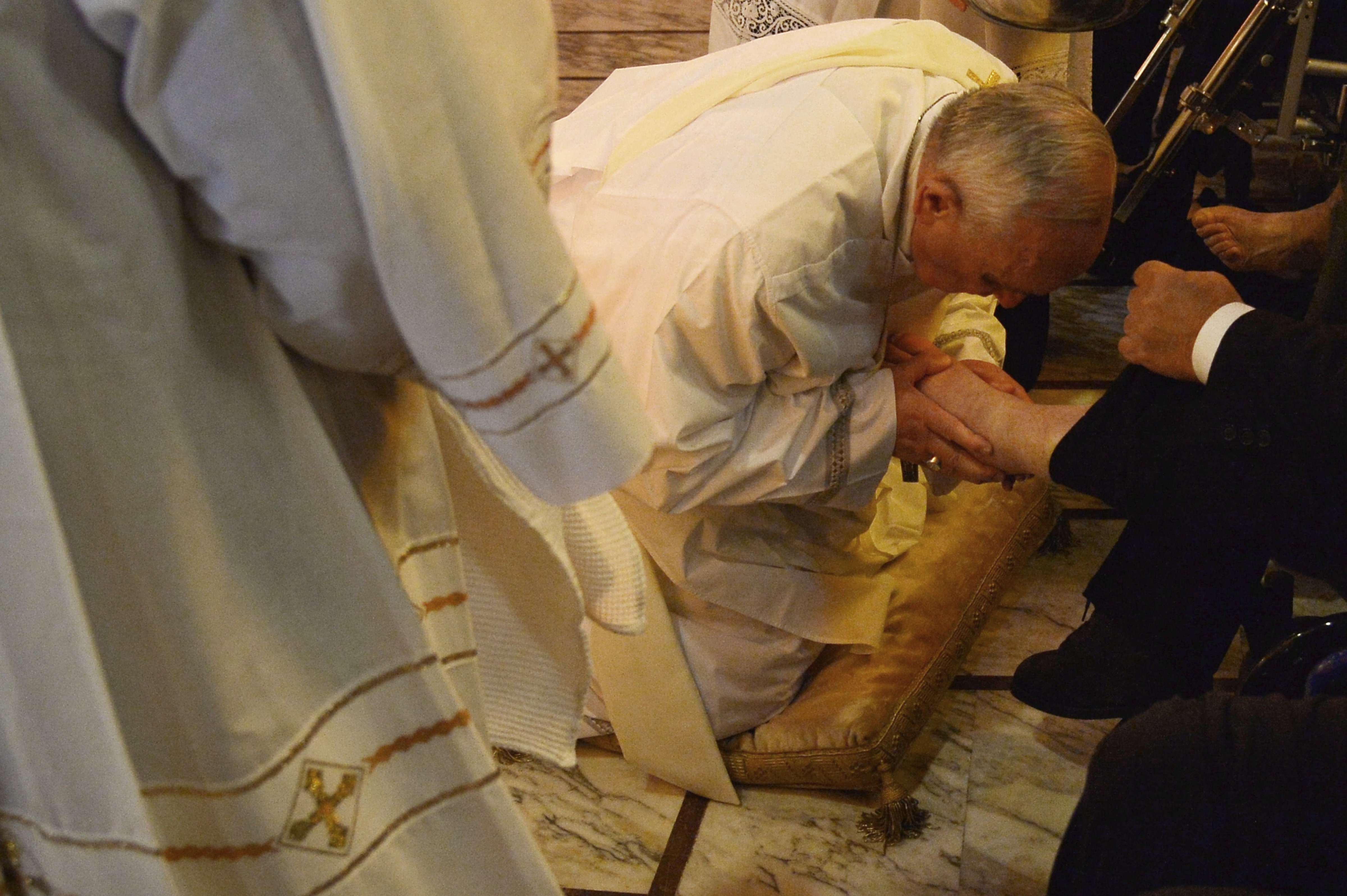 Pope Francis performs the traditional washing of the feet during a visit at a center for disabled people as part of Holy Thursday and Holy Week, April 17, 2014 in Rome. (ALBERTO PIZZOLI&mdash;AFP/Getty Images)