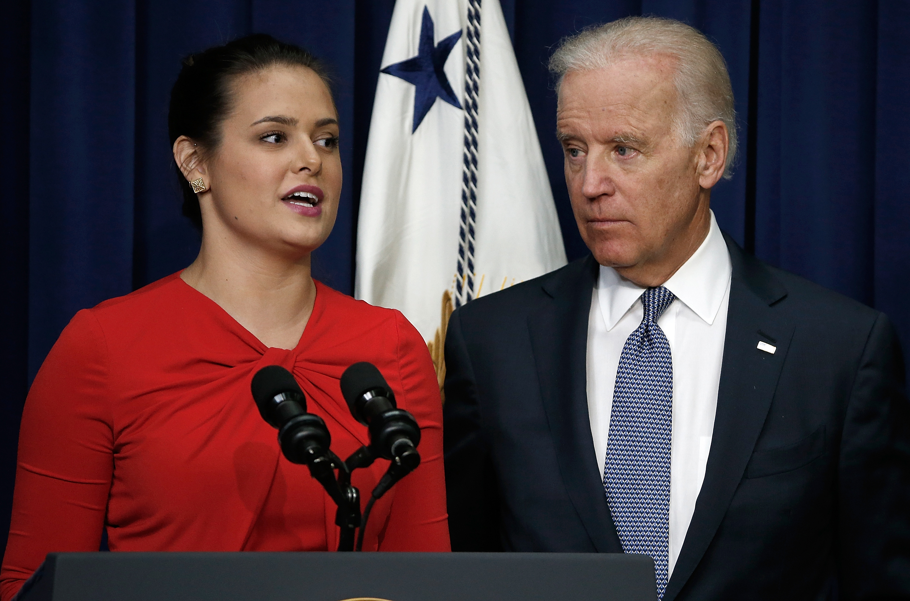 U.S Vice President Joe Biden listens as Madeleine Smith, a graduate of Harvard University who was raped while attending college, speaks during an event at the Eisenhower Executive Office Building, April 29, 2014 in Washington, DC. During the event, Biden announced the release of the first report of the White House Task Force to Protect Students from Sexual Assault. (Win McNamee&mdash;Getty Images)