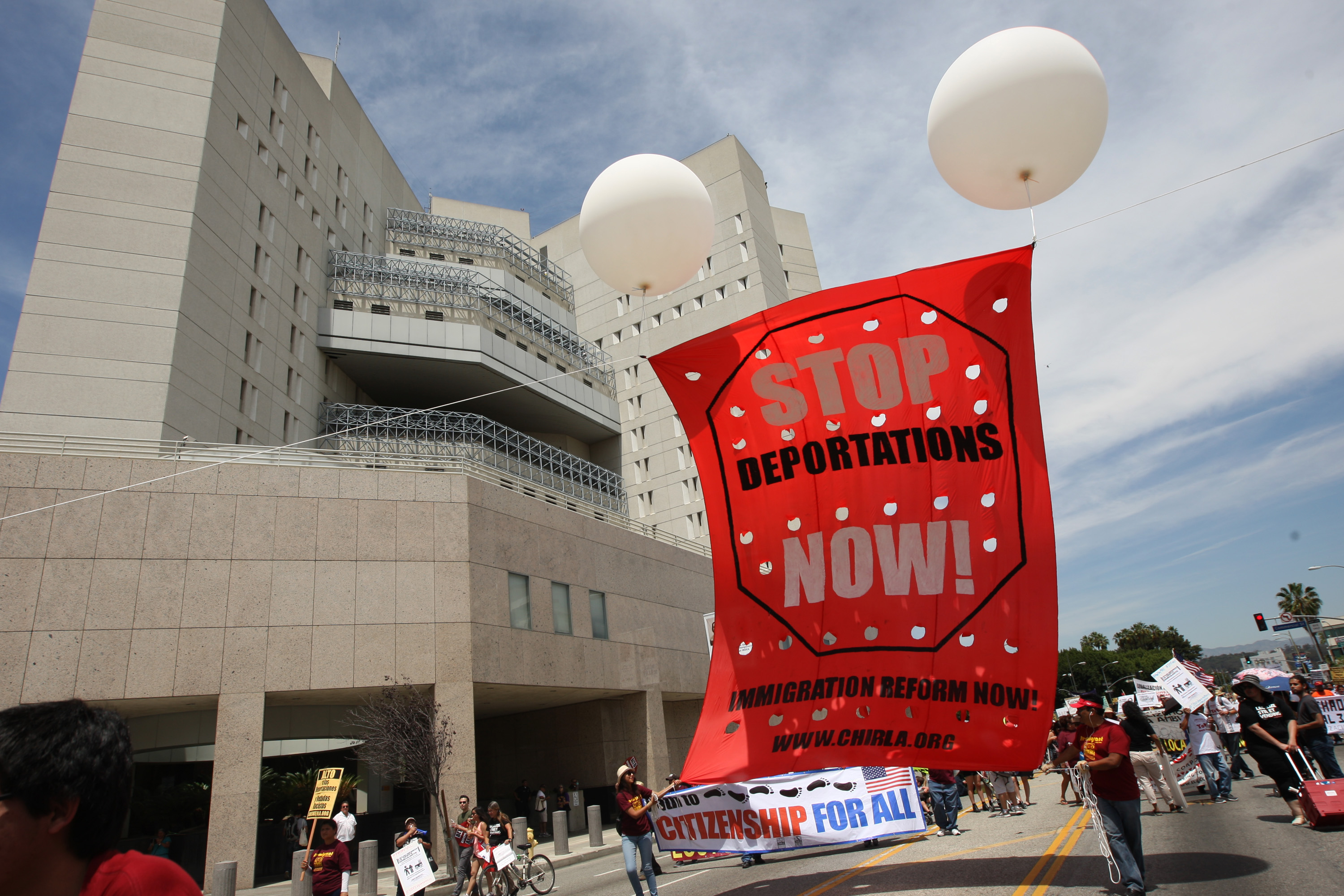 Marchers pass by the Metropolitan Detention Center during one a several May Day immigration-themed events on May 1, 2014 in Los Angeles, California. (David McNew&amp;mdash;Getty Images)