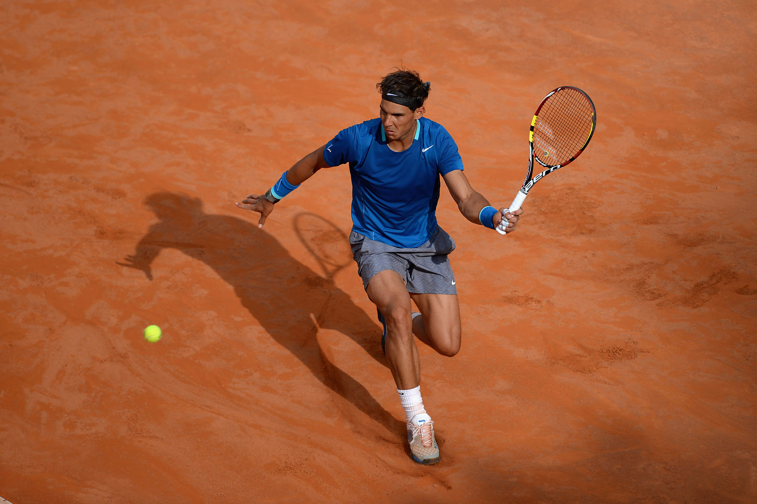 Rafael Nadal of Spain in action against Mikhail Youzhny of Russia during day 5 of the Internazionali BNL d'Italia 2014 on May 15, 2014 in Rome. (Michael Regan—Getty Images)