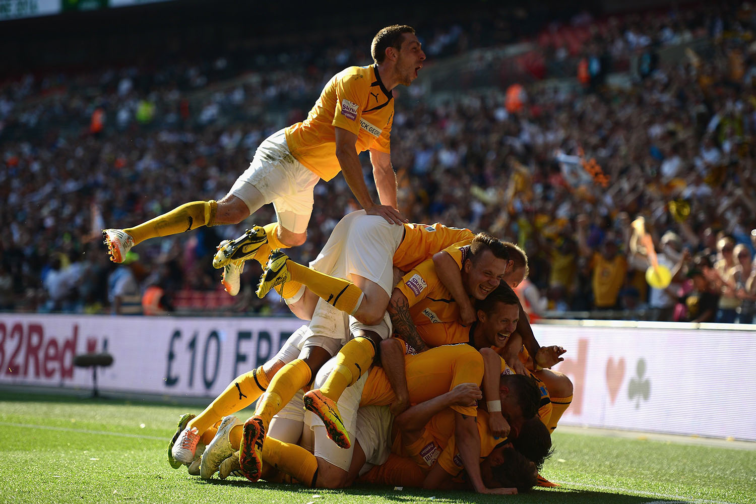 Ryan Donaldson of Cambridge United celebrates his goal with team mates during the Skrill Conference Premier Play-Offs Final between Cambridge United and Gateshead FC at Wembley Stadium in London, on May 18, 2014.