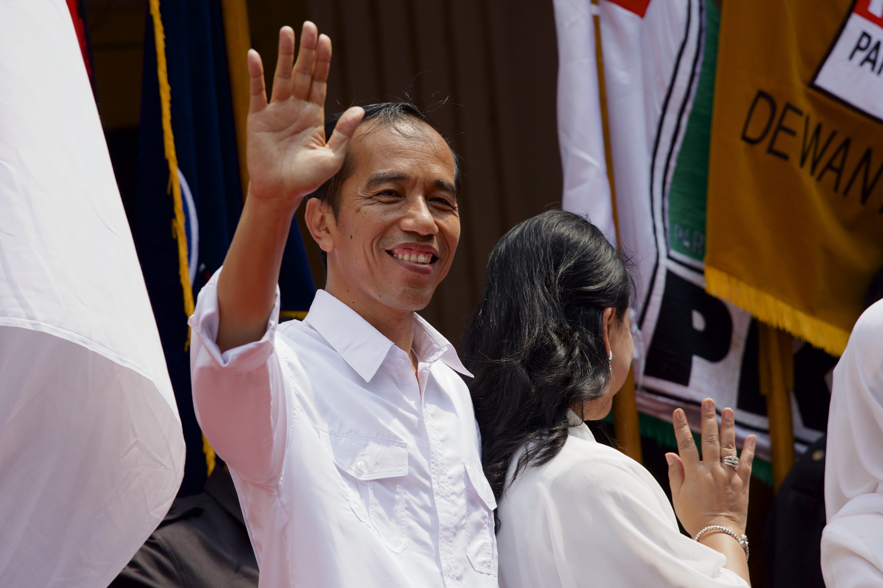 Indonesian presidential candidate Joko Widodo waves to a crowd of supporters after officially naming Jusuf Kalla as his vice-presidential running mate in Jakarta on May 19, 2014 (Ed Wray—Getty Images)