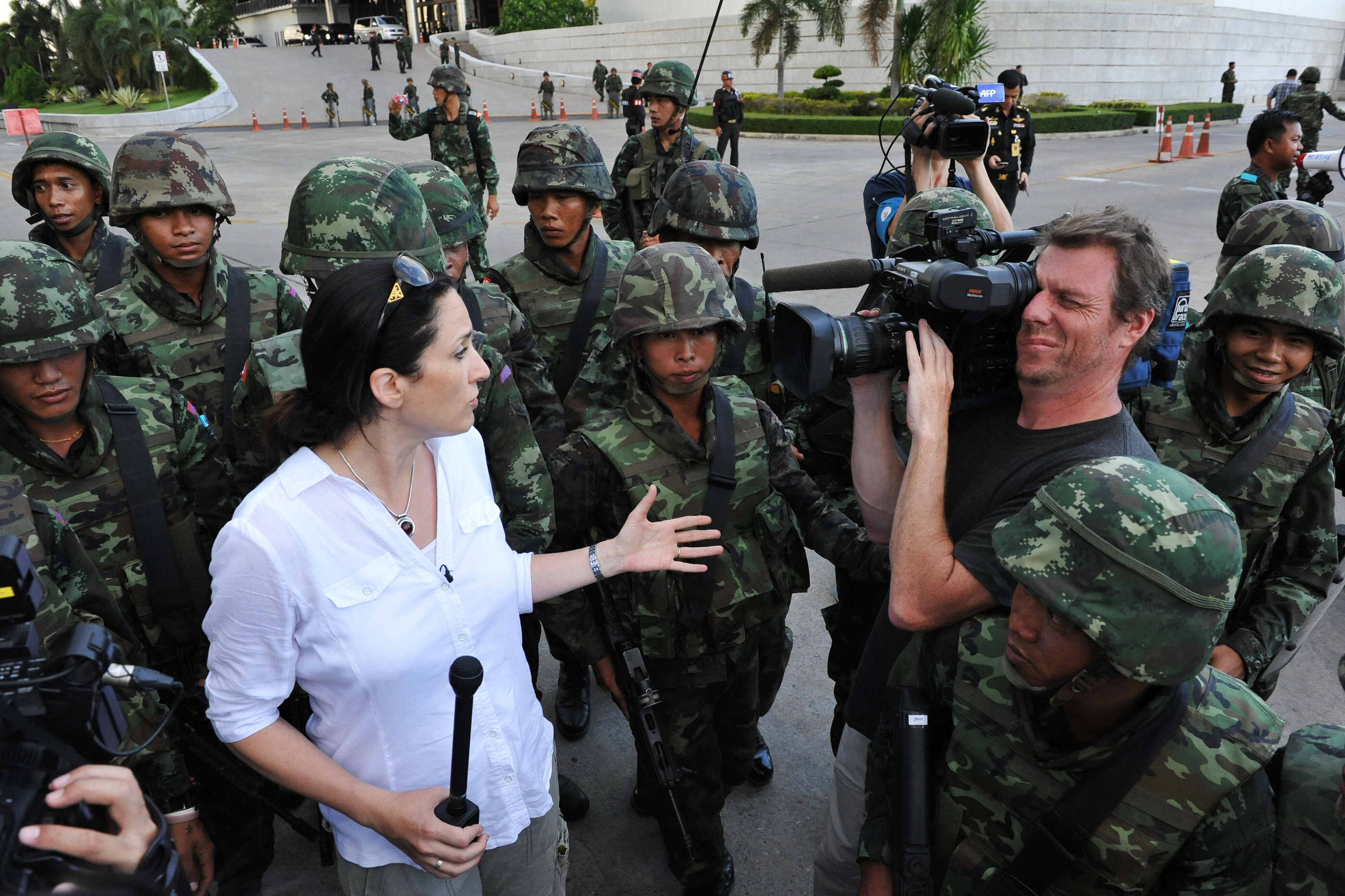 Thai soldiers move foreign press on as they secure the grounds of the venue for peace talks between pro- and antigovernment groups as the army announces it is seizing power in Bangkok on May 22, 2014 (Rufus Cox—Getty Images)