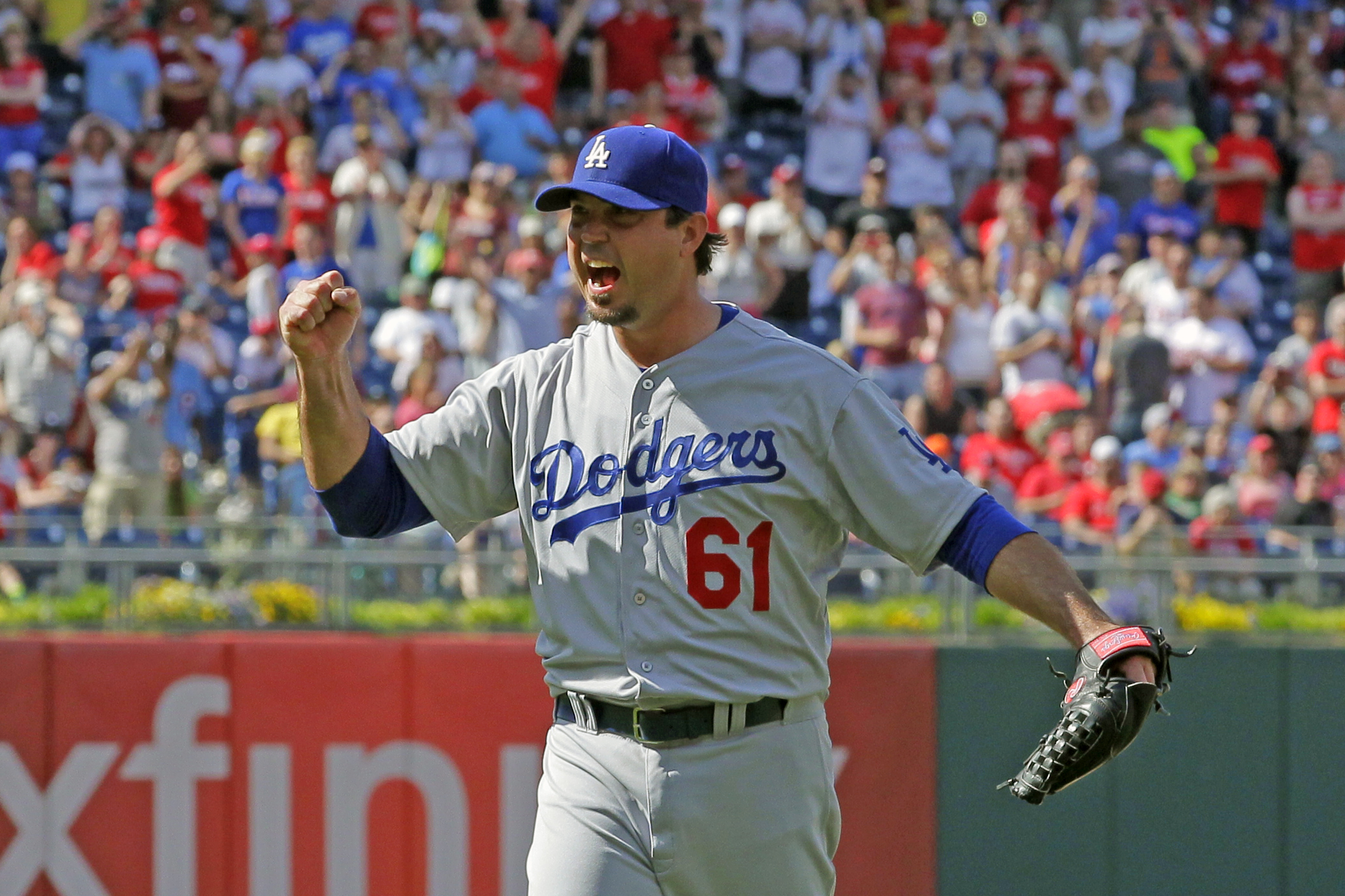 Josh Beckett of the Los Angeles Dodgers celebrates in the ninth inning after recording a no hitter during a game against the Philadelphia Phillies at Citizens Bank Park on May 25, 2014 in Philadelphia, Pennsylvania. (Hunter Martin—Getty Images)