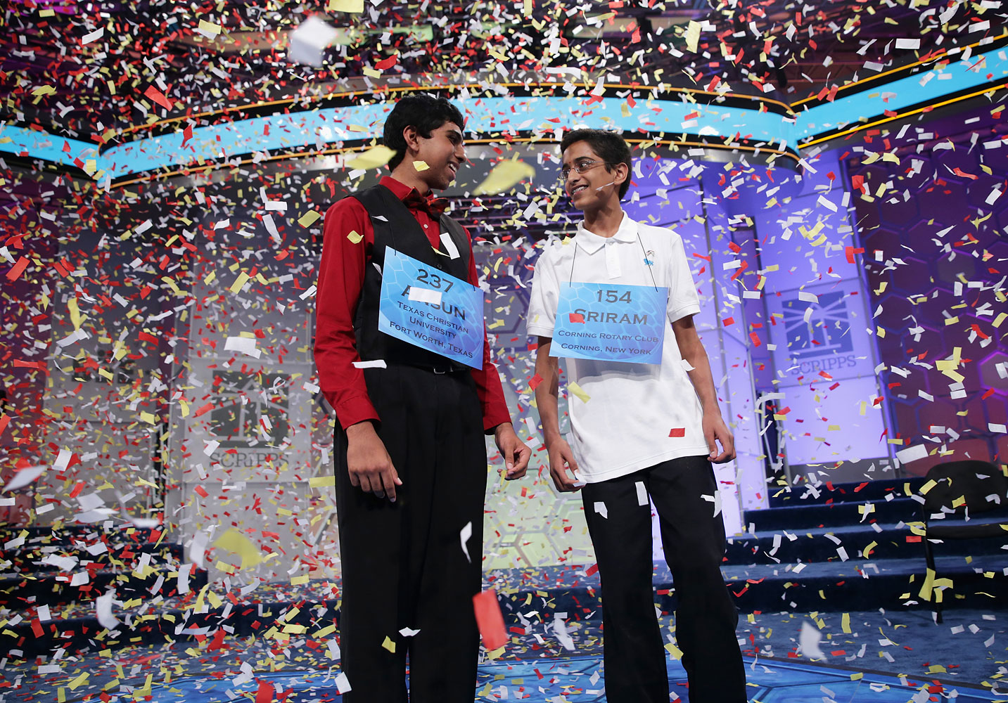 NATIONAL HARBOR, MD - MAY 29:  Confetti falls after Sriram Hathwar, right, of Painted Post, New York and Ansun Sujoe, left, of Fort Worth, Texas both won the 2014 Scripps National Spelling Bee competition May 29, 2014 in National Harbor, Maryland. (Alex Wong—Getty Images)