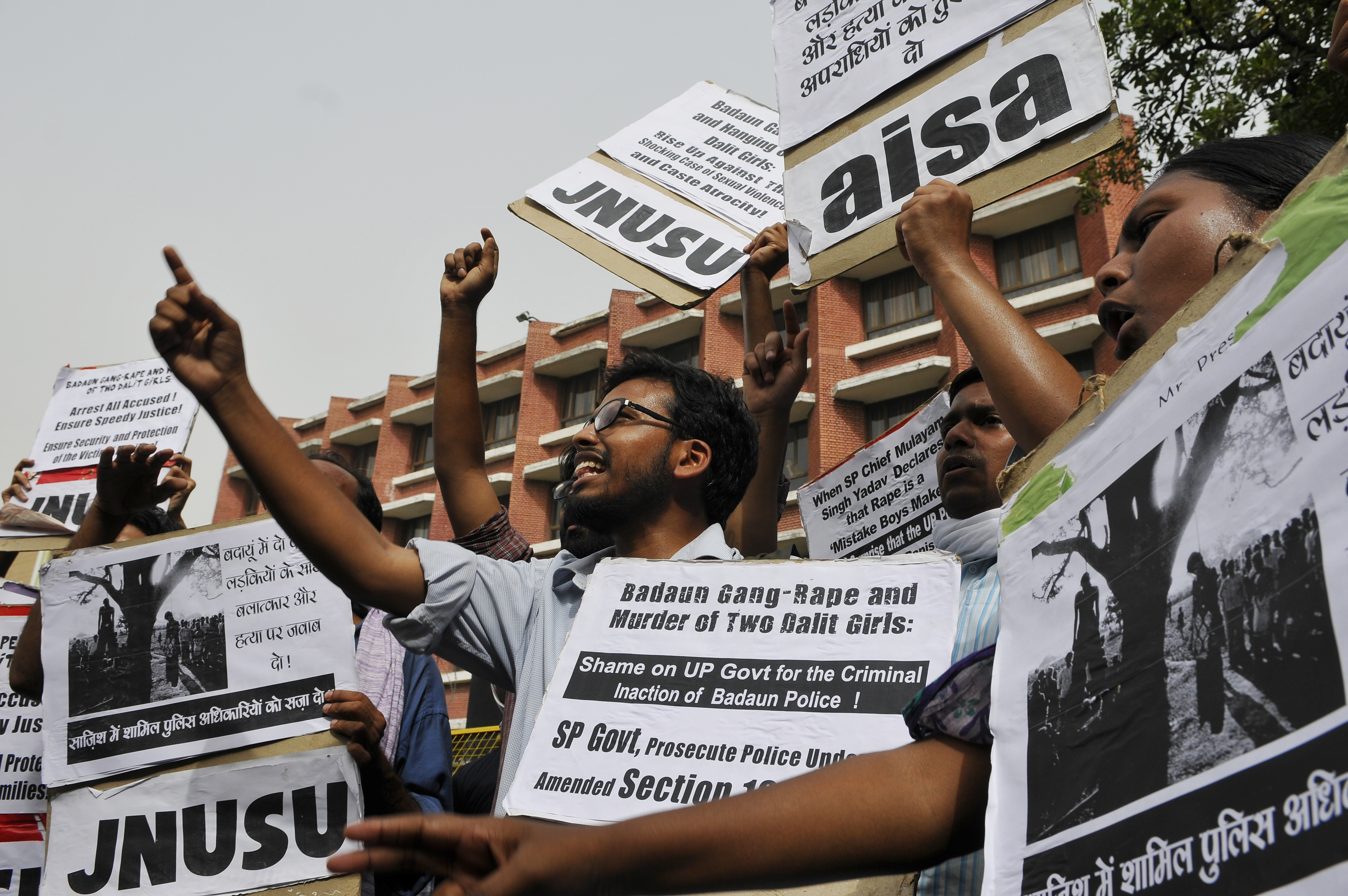 Jawaharlal Nehru University Students Union activists shouting slogans in front of Uttar Pradesh Bhawan against the gruesome gang-rape and hanging of two Dalit girls in Badaun, demanding immediate arrest of all the culprits on May 30, 2014 in New Delhi, India. (Hindustan Times—Hindustan Times via Getty Images)