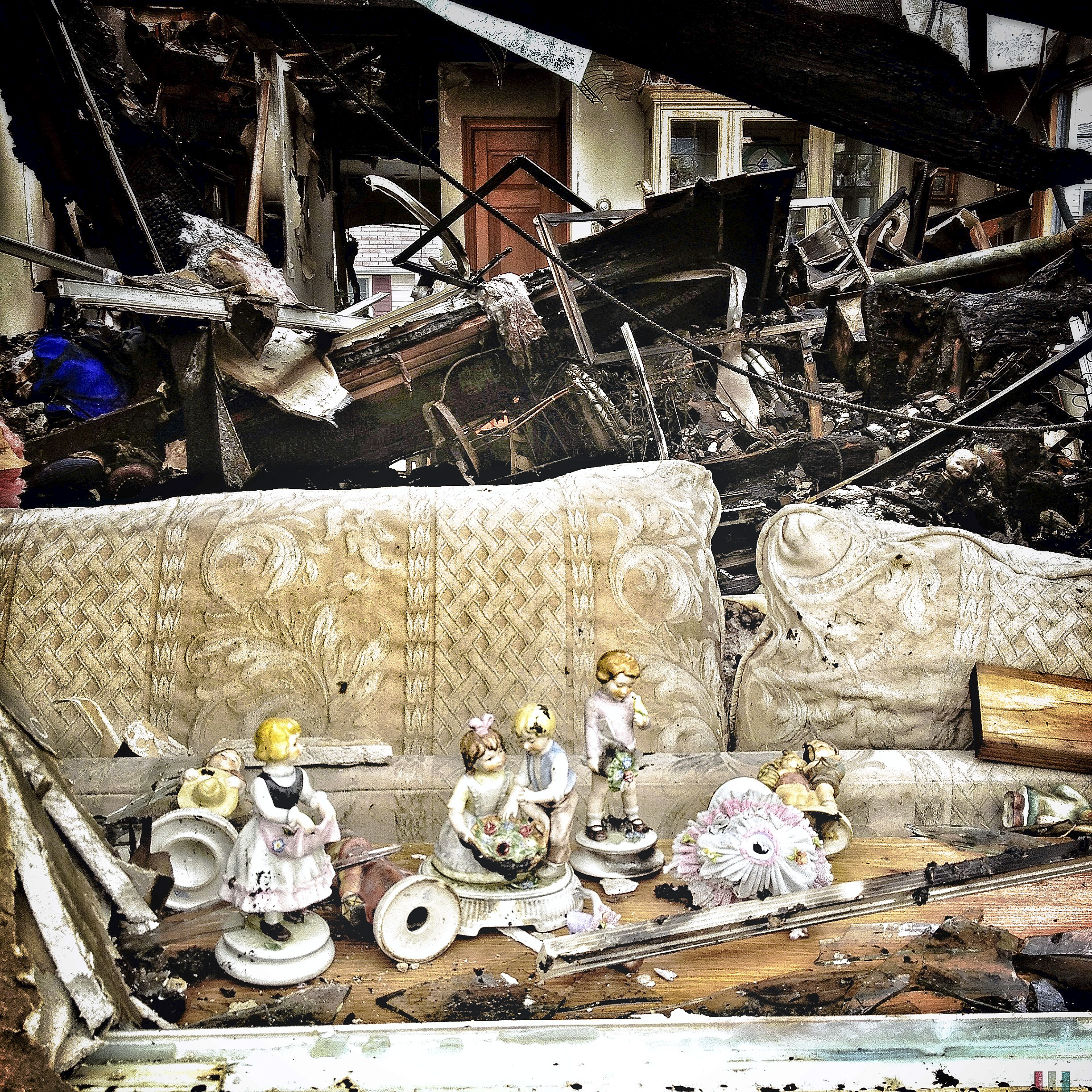 Remnants of a home in the Breezy Point area of Queens are displaced and re-arranged on a sofa after hurricane Sandy tore through the seaside community.