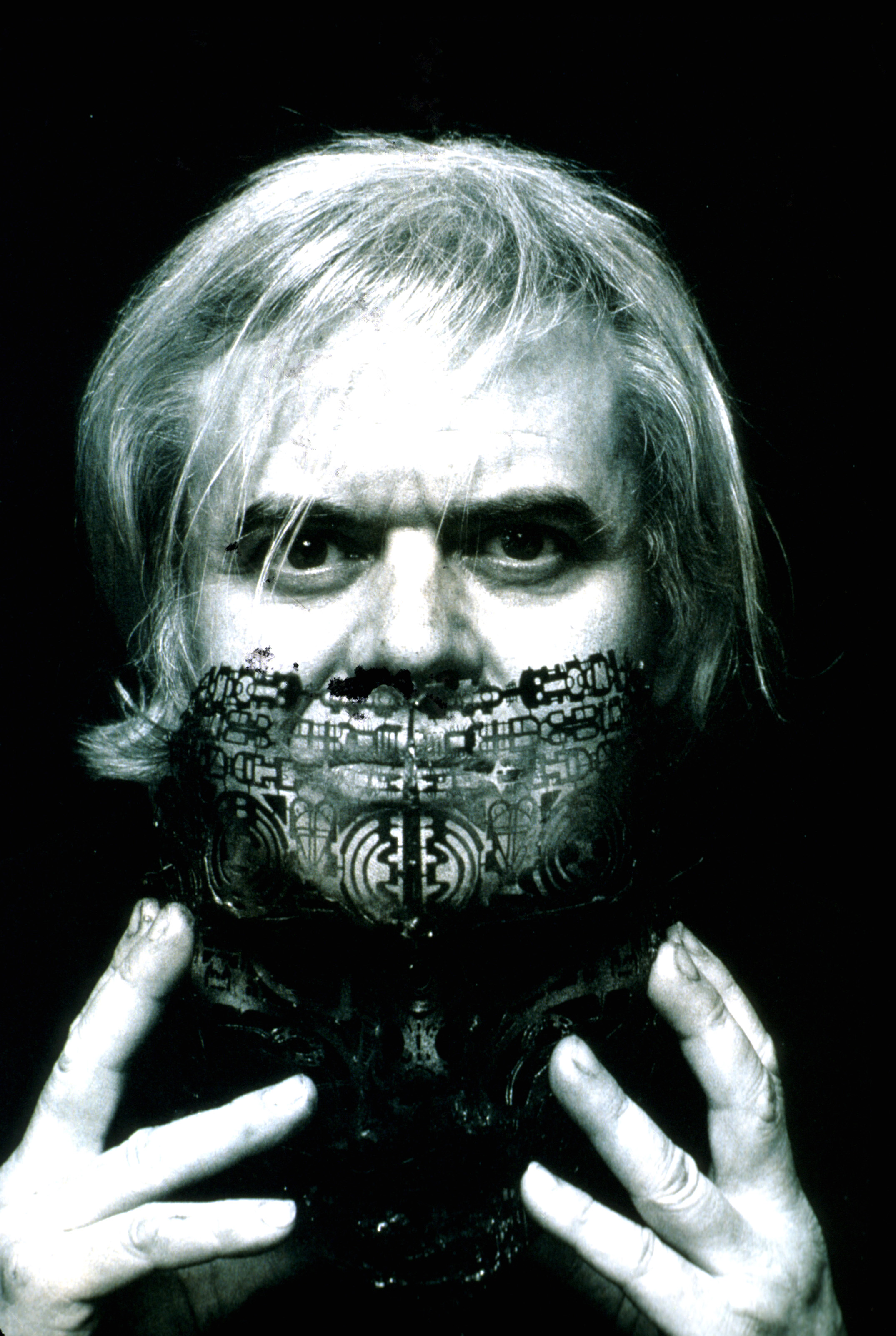 Visual artist H. R. Giger taking off face mask. (Peter van Agtmael—Magnum for MSNBC)